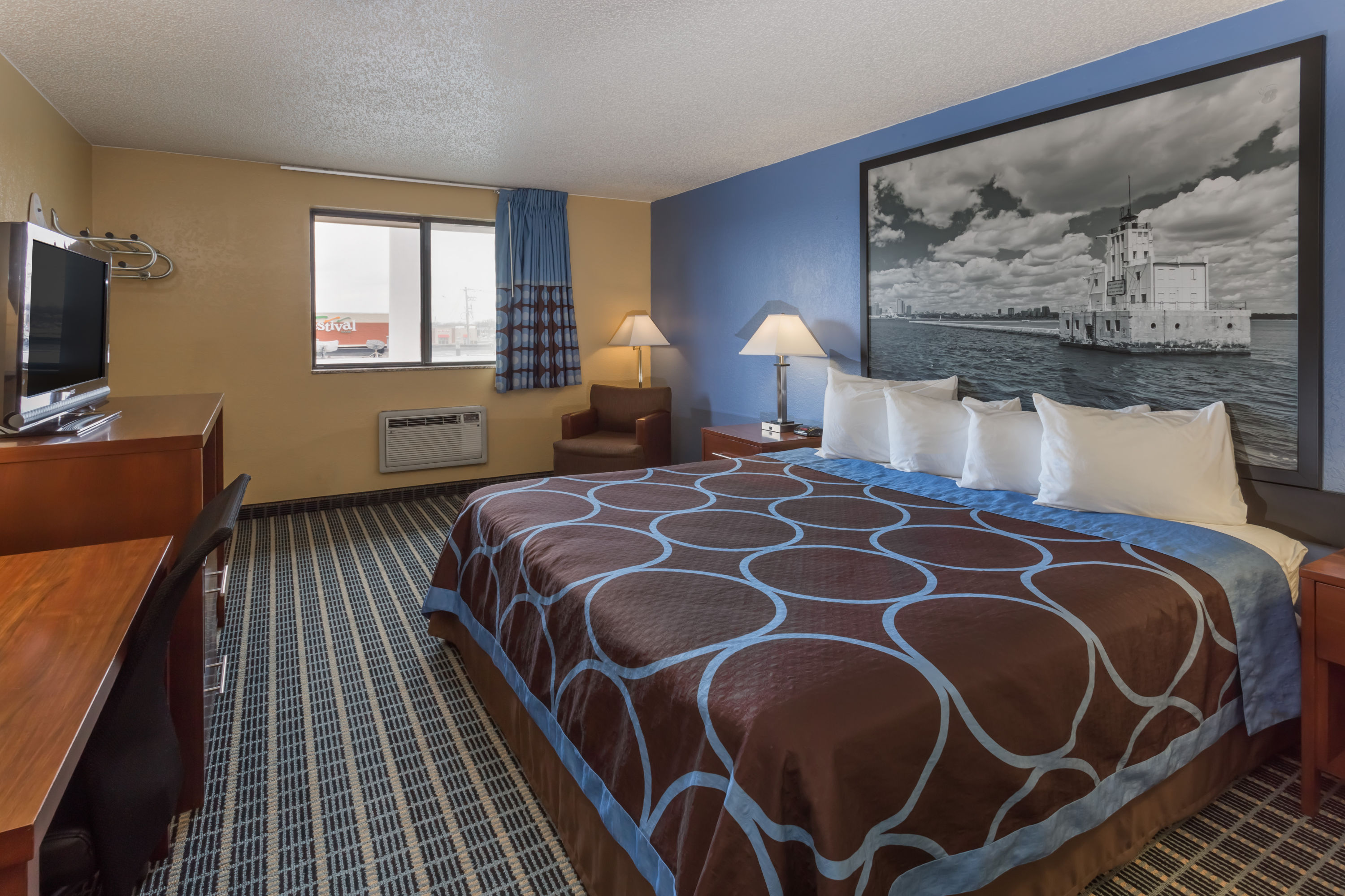 Guest room at the Super 8 by Wyndham Janesville in Janesville, Wisconsin