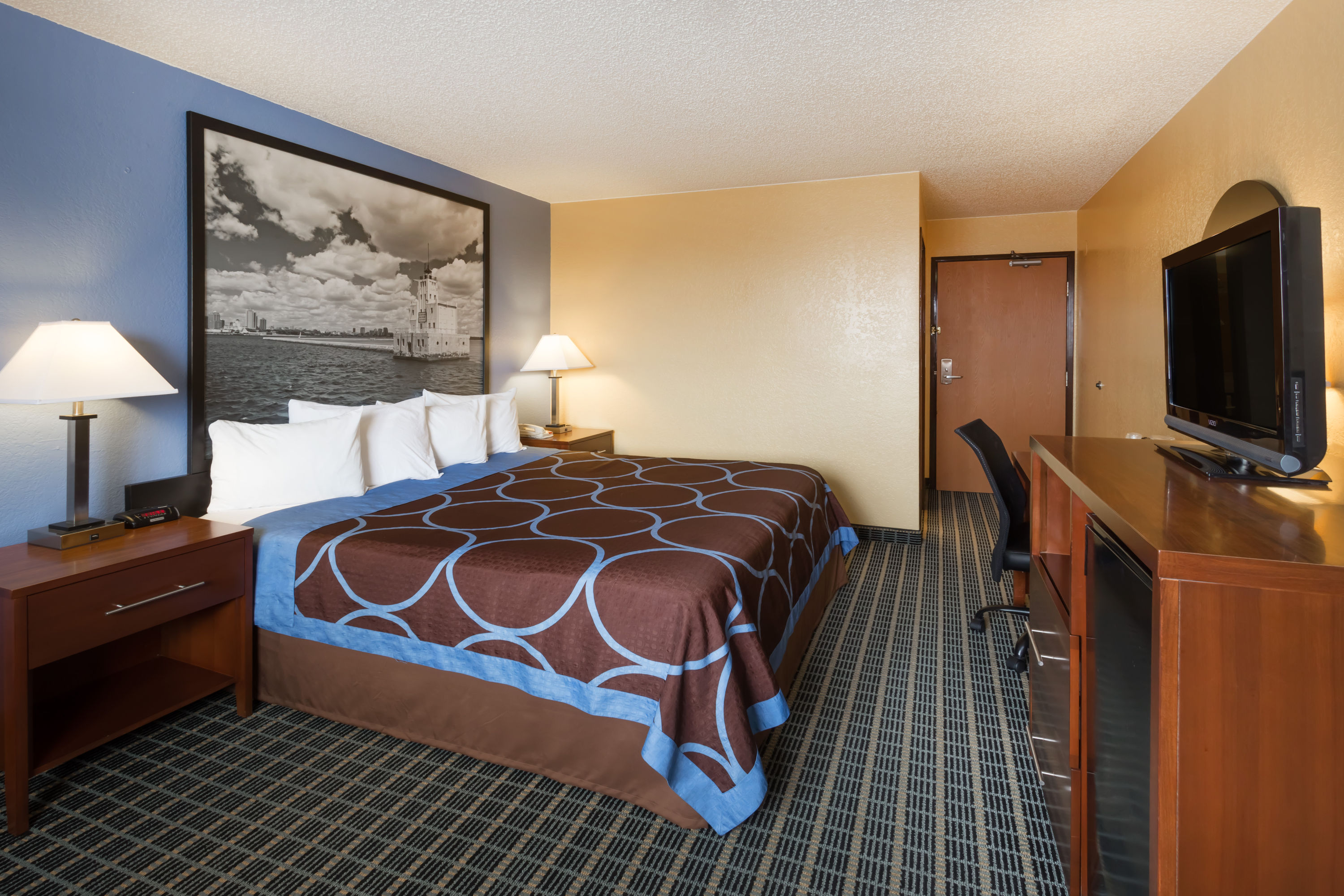 Guest room at the Super 8 by Wyndham Janesville in Janesville, Wisconsin