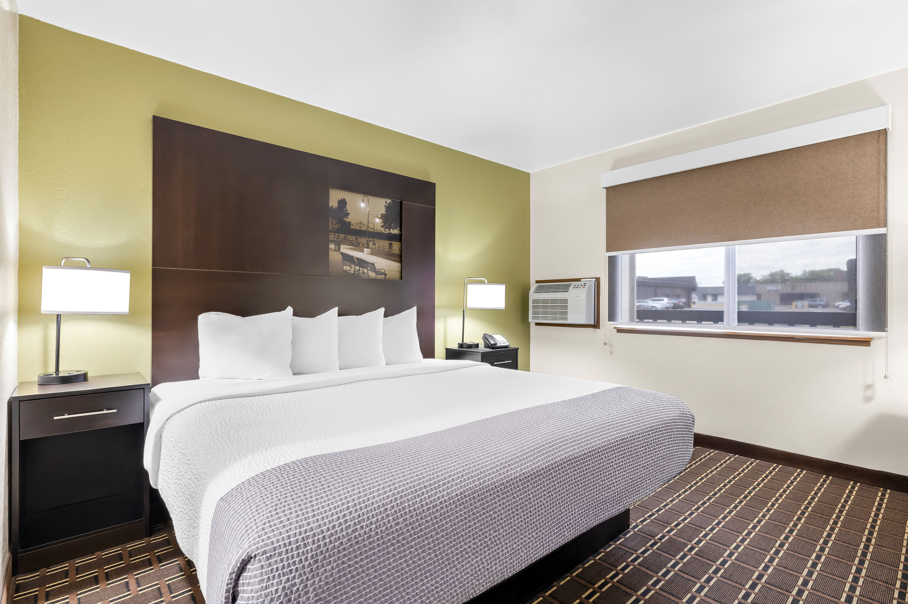 King bed guest room at the Super 8 by Wyndham La Crosse in La Crosse, Wisconsin