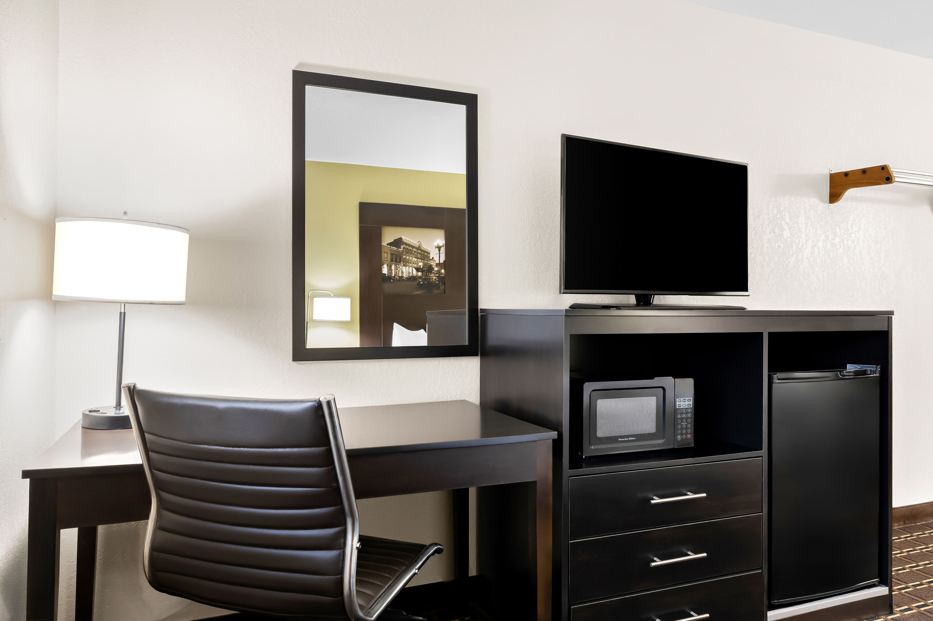 Queen bed guest room at the Super 8 by Wyndham La Crosse in La Crosse, Wisconsin