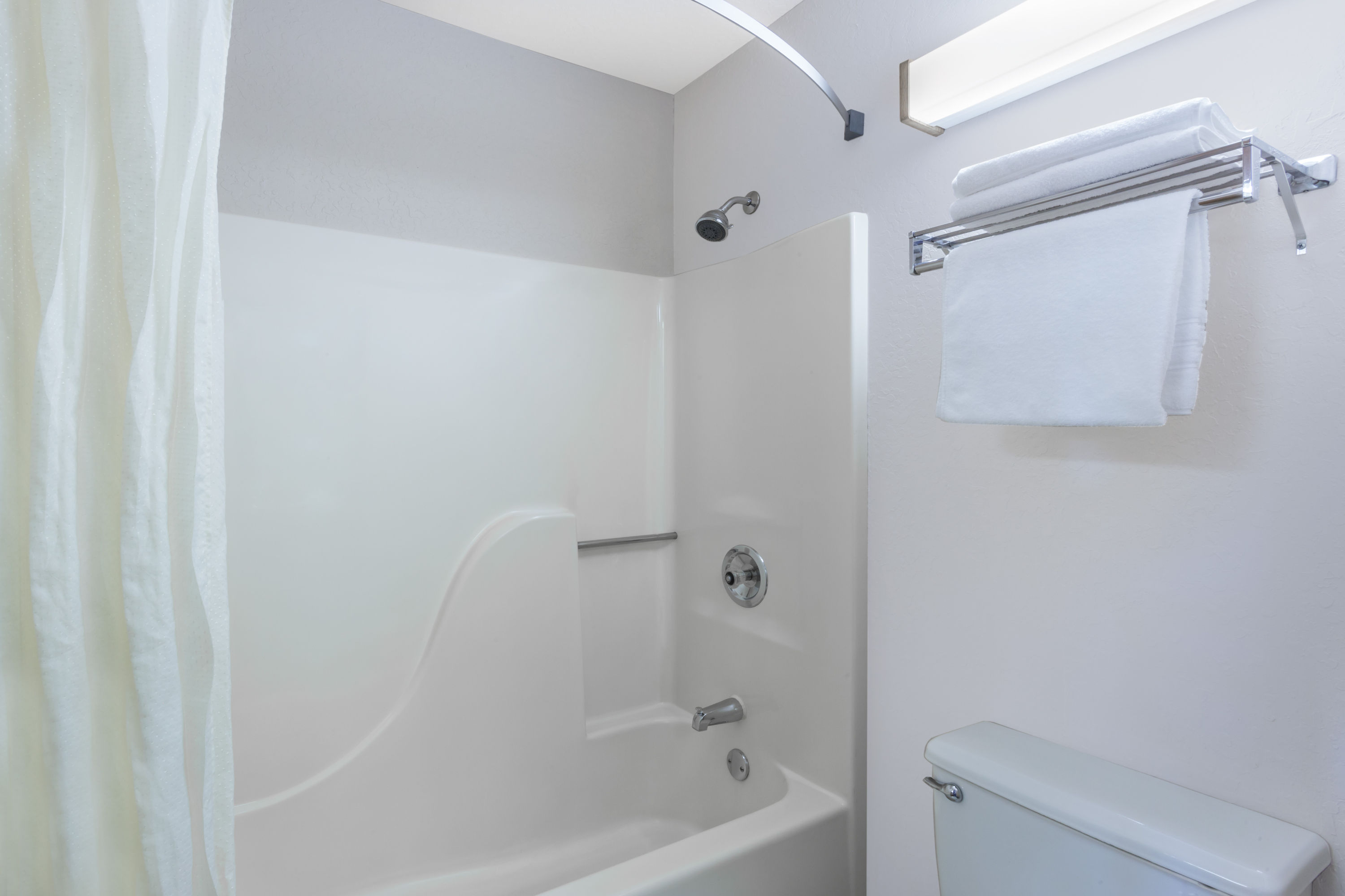 Guest room bath at the Super 8 by Wyndham Madison South in Madison, Wisconsin