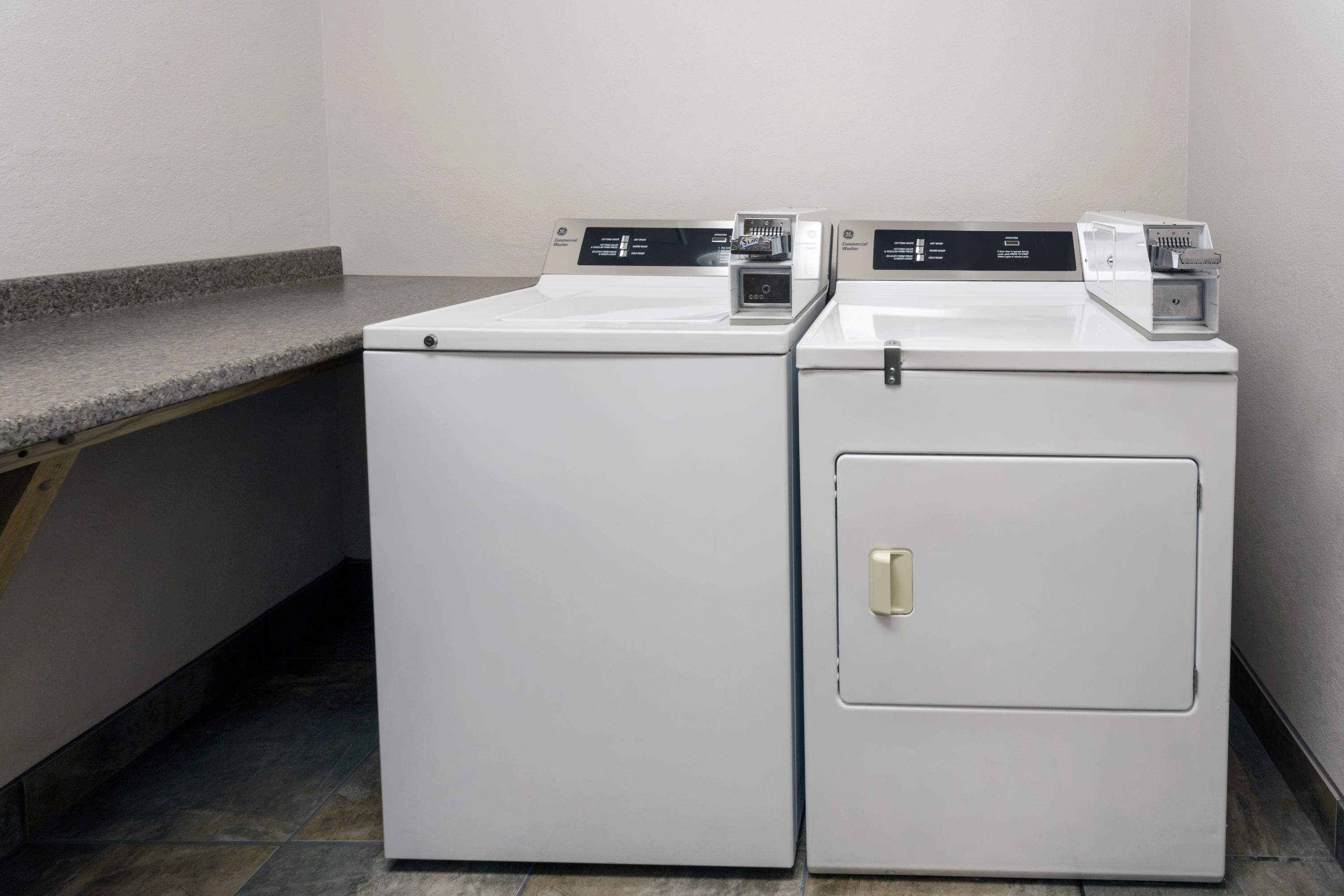 Laundry facilities at Super 8 by Wyndham Madison South in Madison, Wisconsin