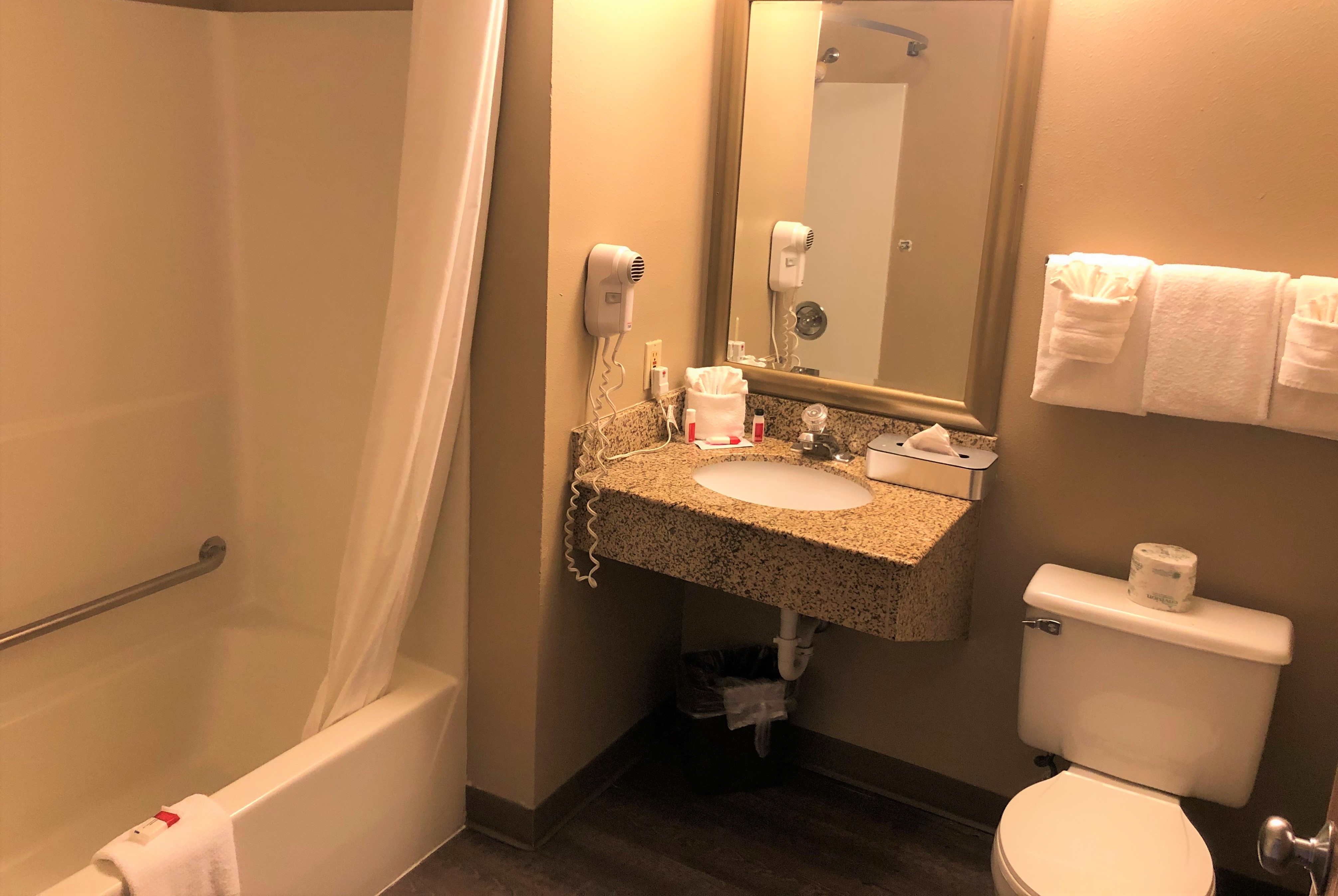 Guest room bath at the Super 8 by Wyndham Milwaukee Airport in Milwaukee, Wisconsin
