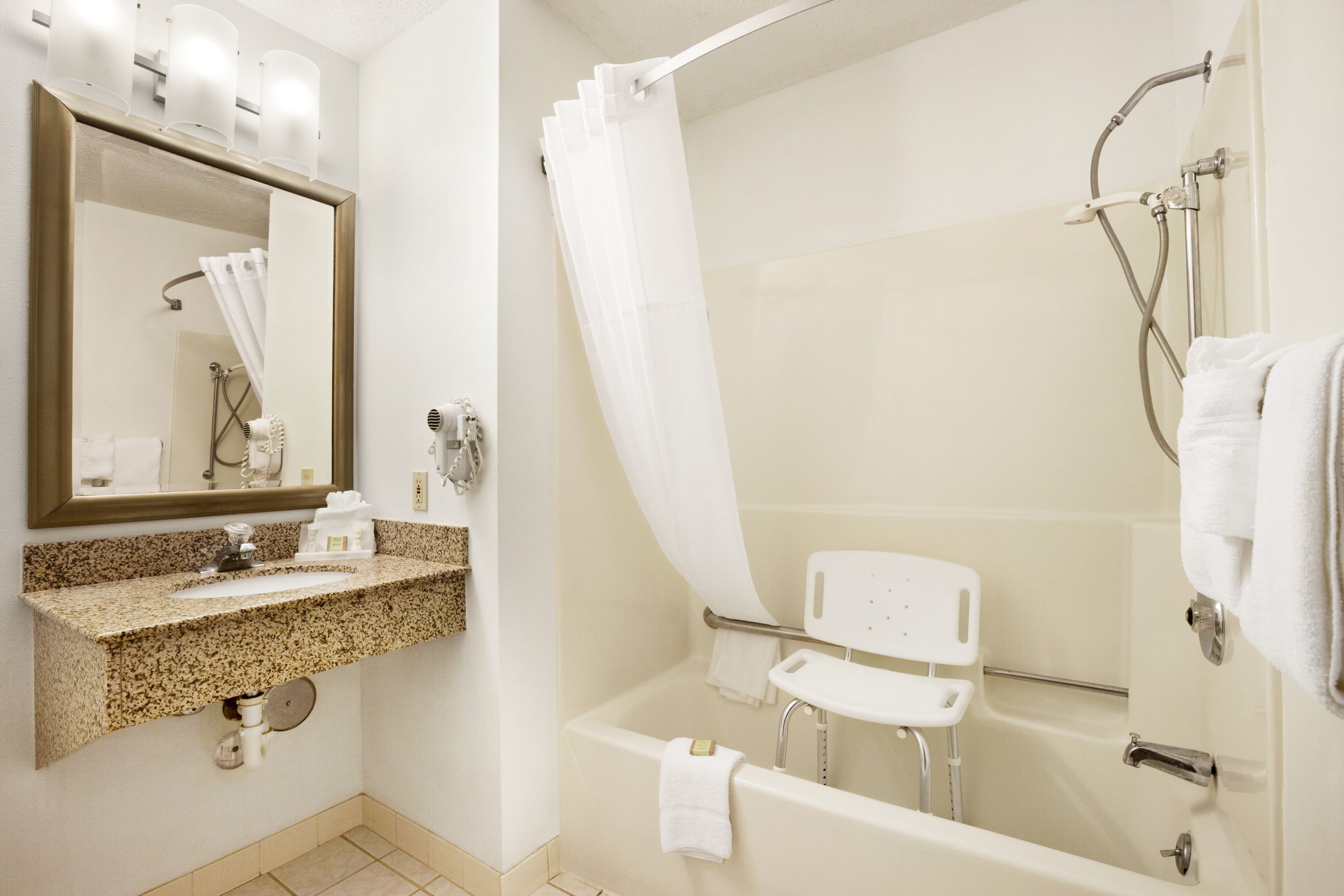 Guest room at the Super 8 by Wyndham Milwaukee Airport in Milwaukee, Wisconsin