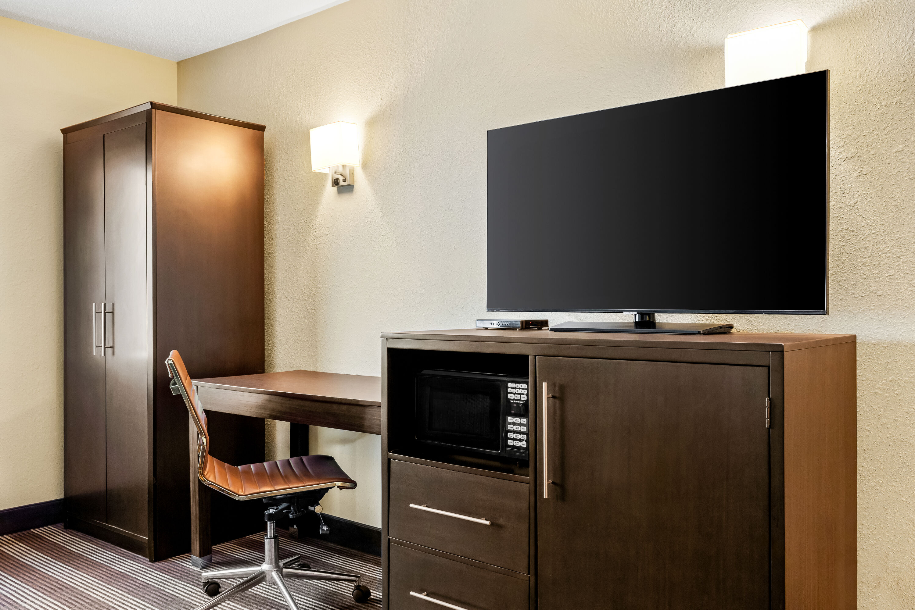 King bed guest room at the Super 8 by Wyndham Osseo WI in Osseo, Wisconsin