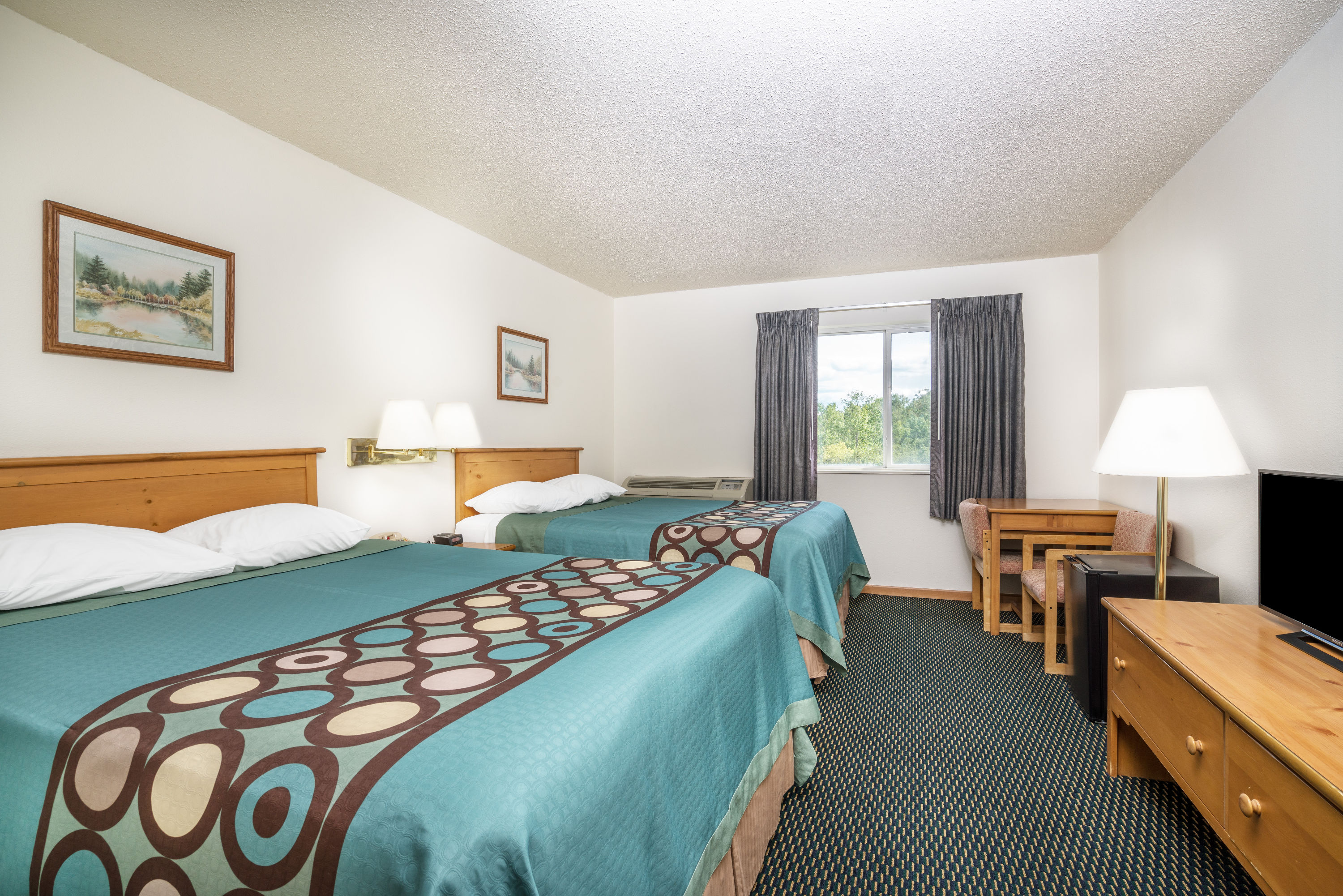 Guest room at the Super 8 by Wyndham Phillips in Phillips, Wisconsin