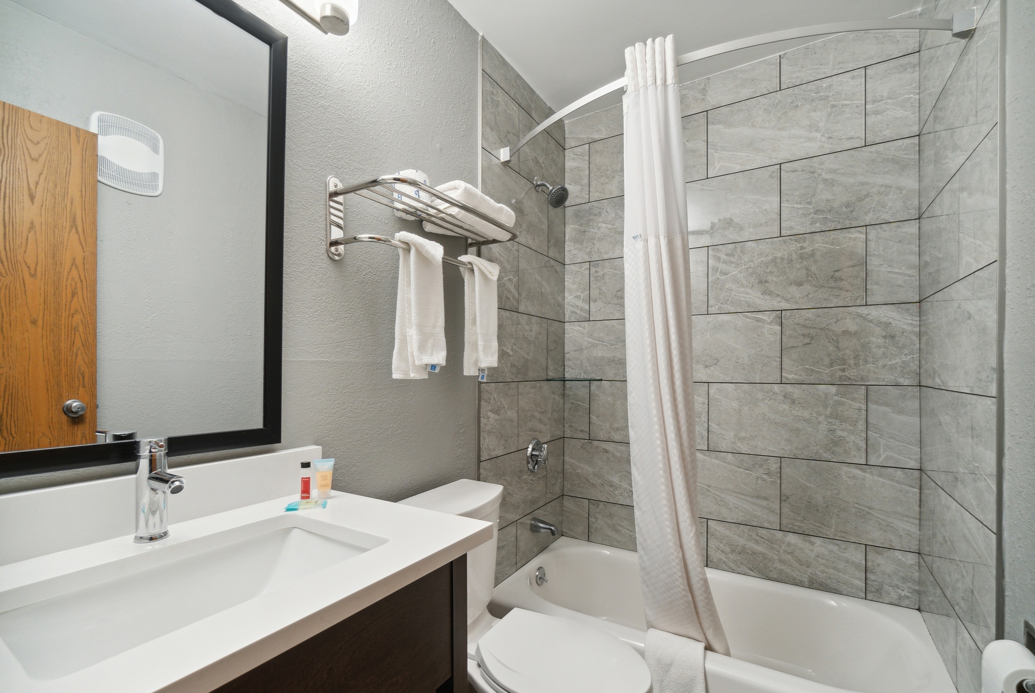 Guest room bath at the Super 8 by Wyndham Kenosha/Pleasant Prairie in Pleasant Prairie, Wisconsin