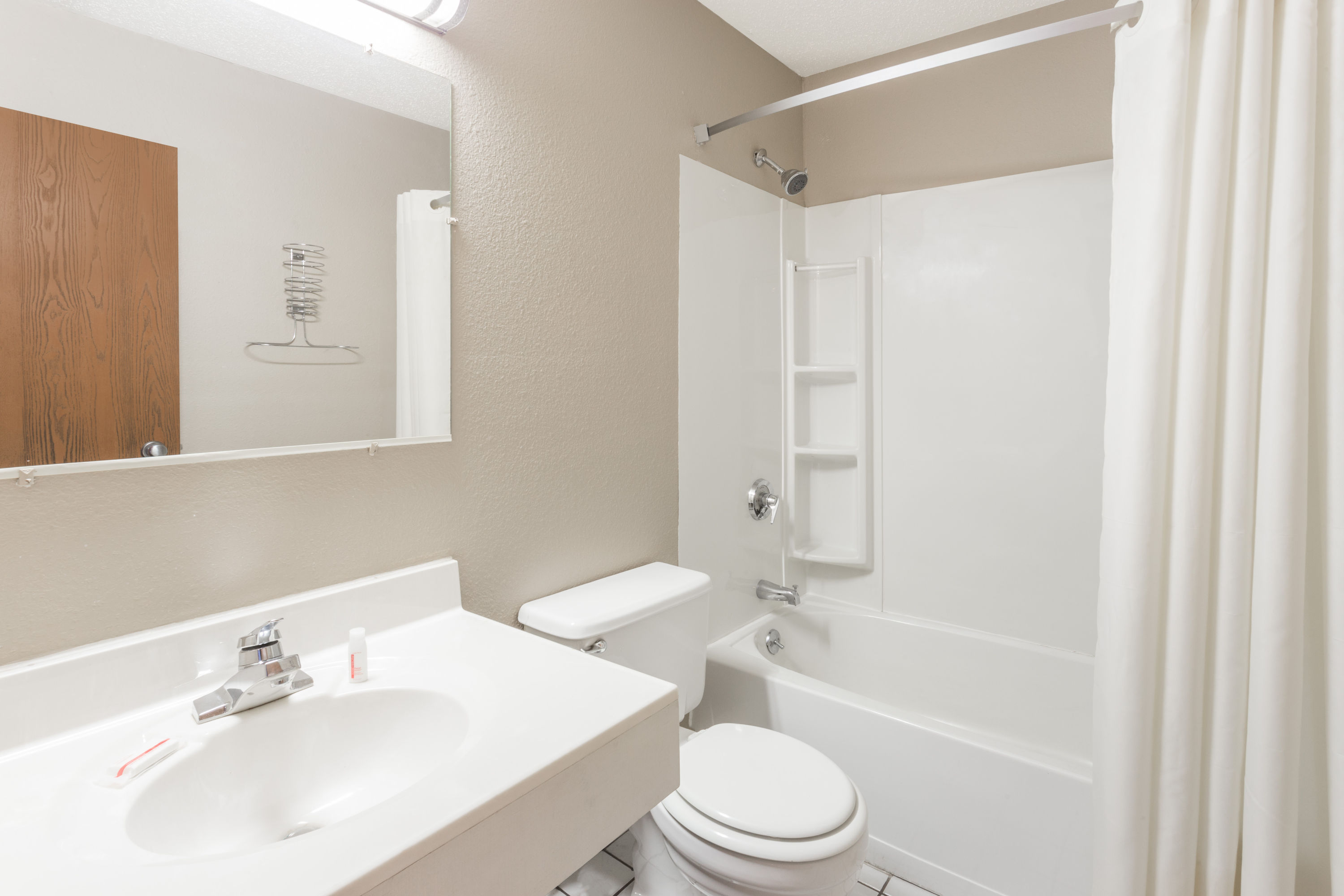 Guest room bath at the Super 8 by Wyndham Kenosha/Pleasant Prairie in Pleasant Prairie, Wisconsin