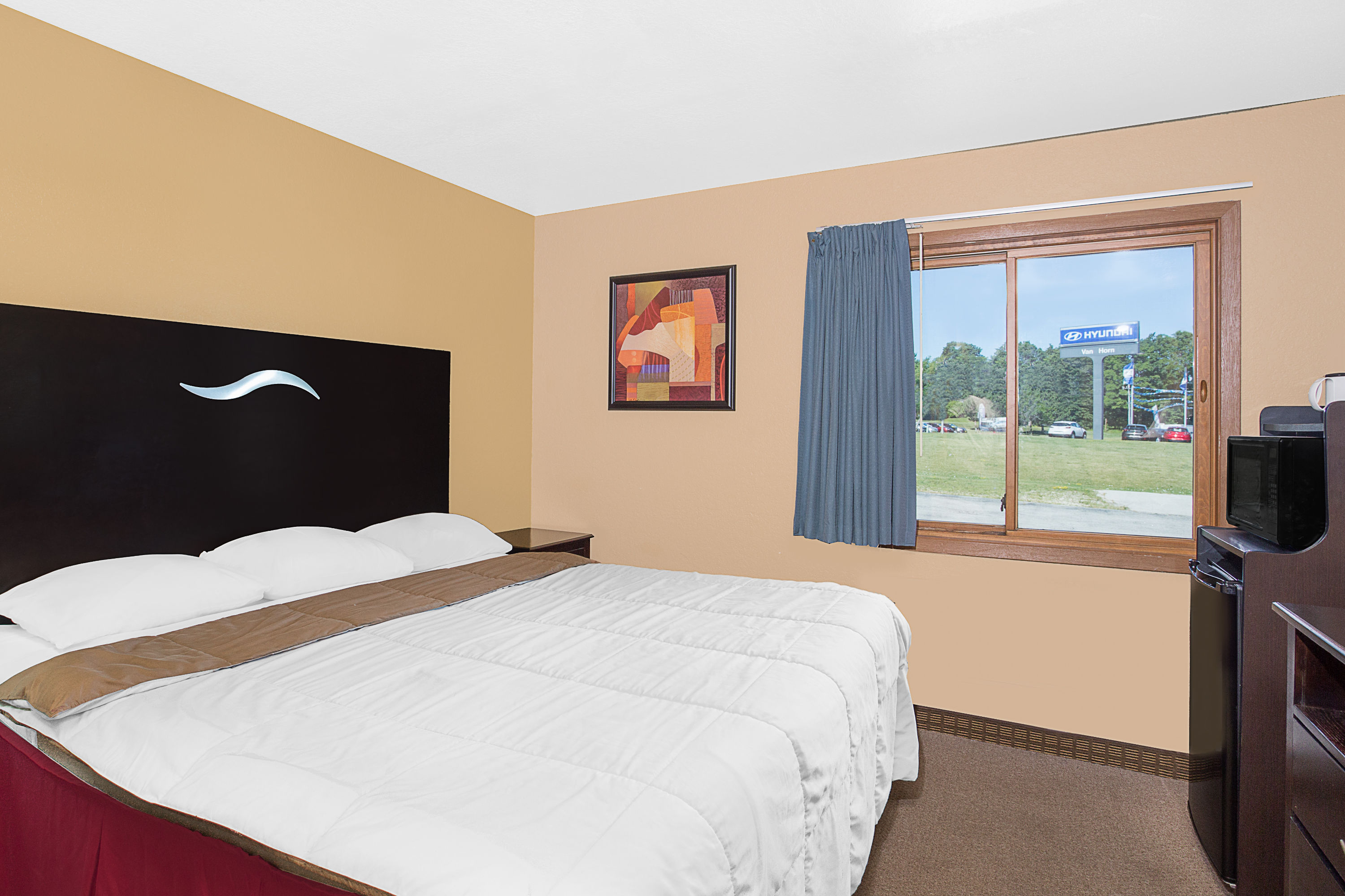 Guest room at the Super 8 by Wyndham Sheboygan WI in Sheboygan, Wisconsin