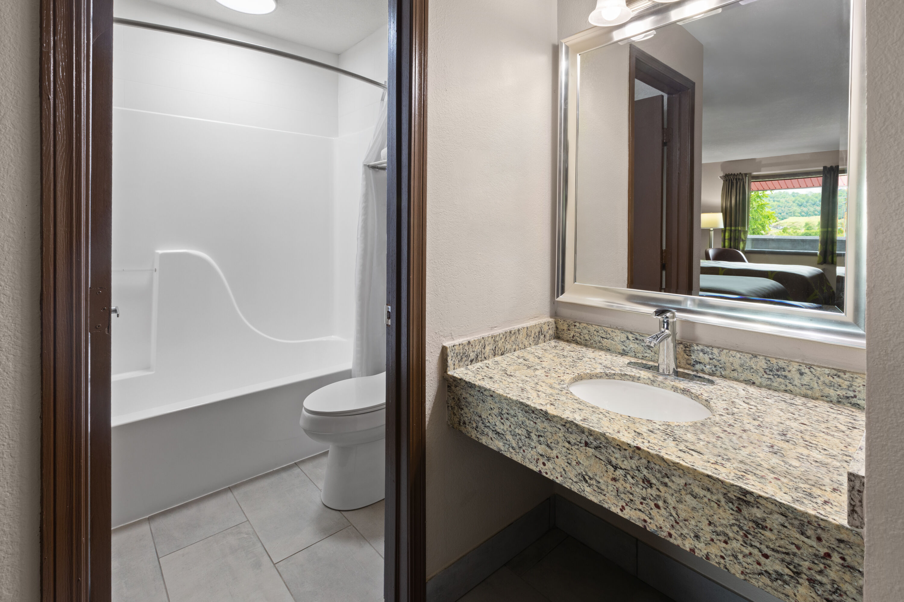 Guest room bath at the Super 8 by Wyndham Bridgeport/Clarksburg Area in Bridgeport, West Virginia