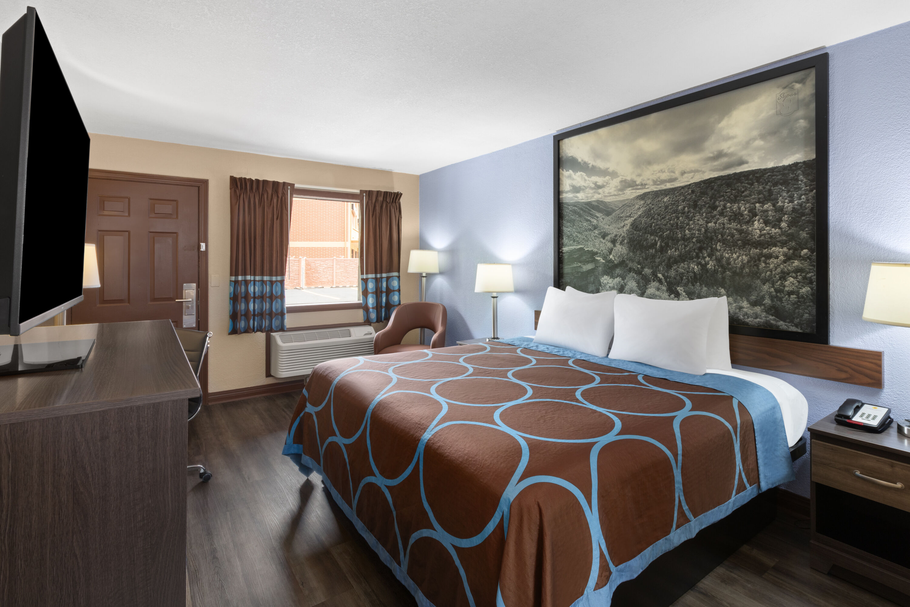 Guest room at the Super 8 by Wyndham Bridgeport/Clarksburg Area in Bridgeport, West Virginia