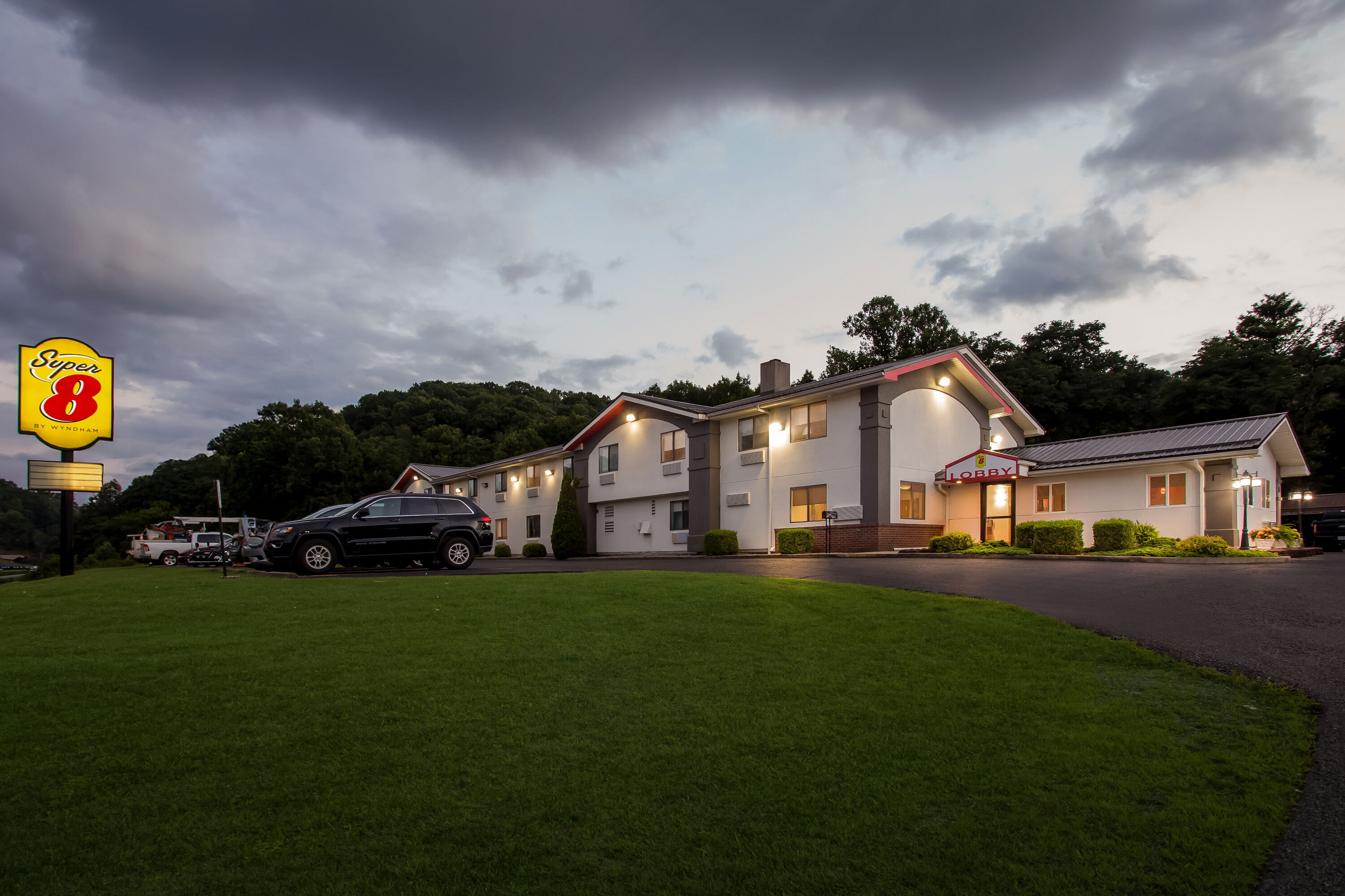 Exterior Night Image of Super 8 by Wyndham Elkins hotel in Elkins, West Virginia