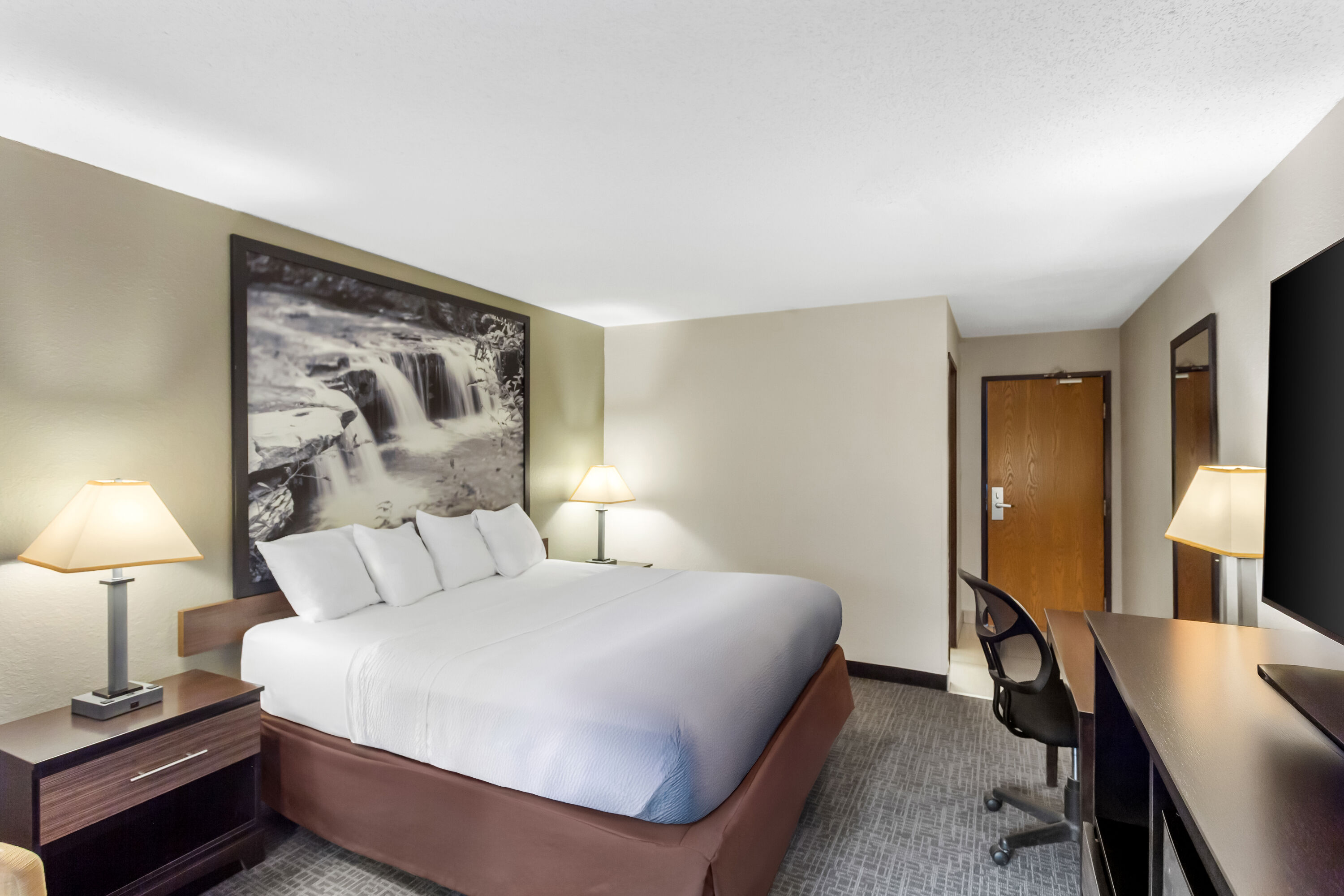 King bed guest room at the Super 8 by Wyndham Elkins in Elkins, West Virginia