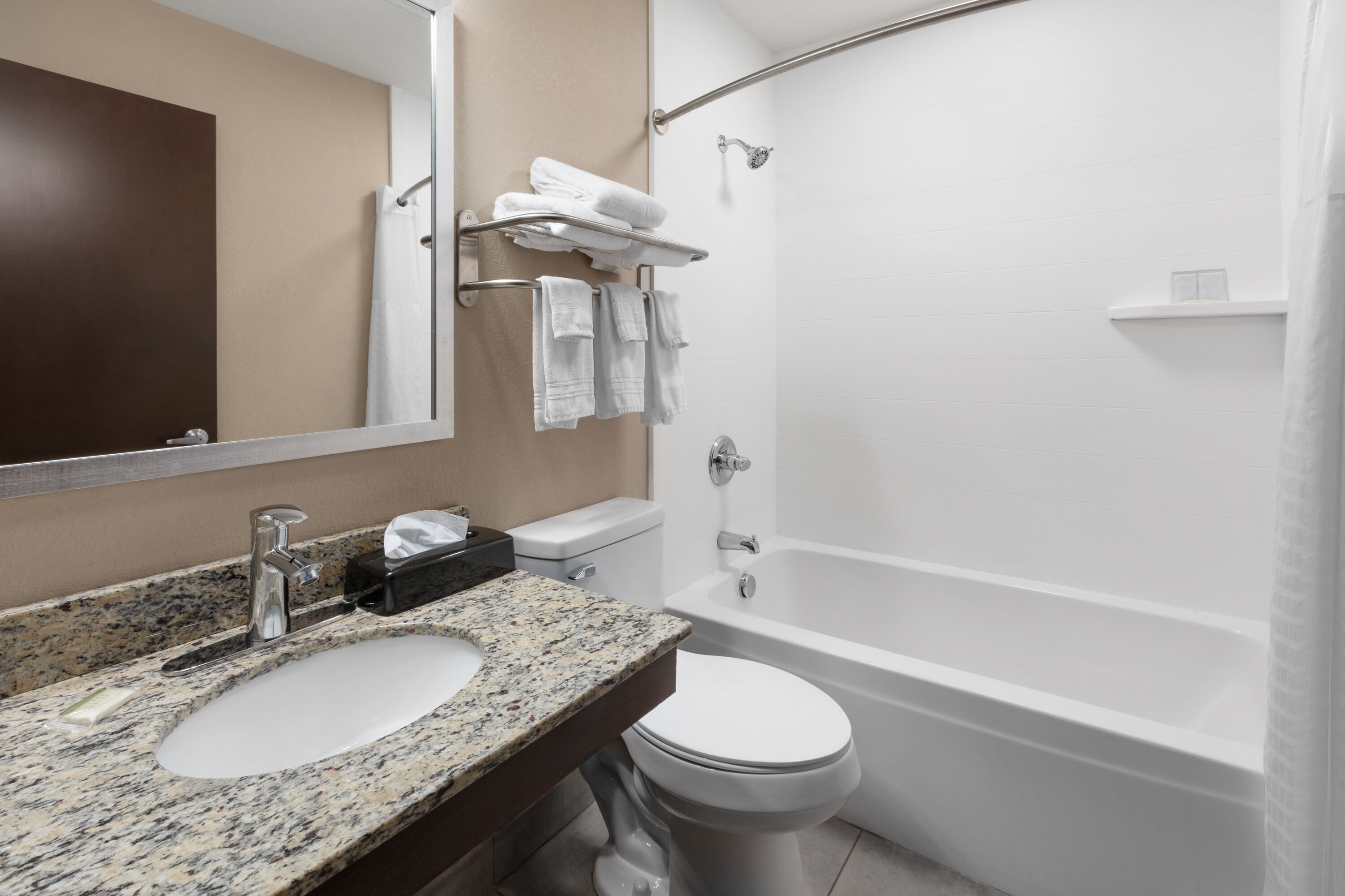 Guest room bath at the Super 8 by Wyndham Fairmont in Fairmont, West Virginia