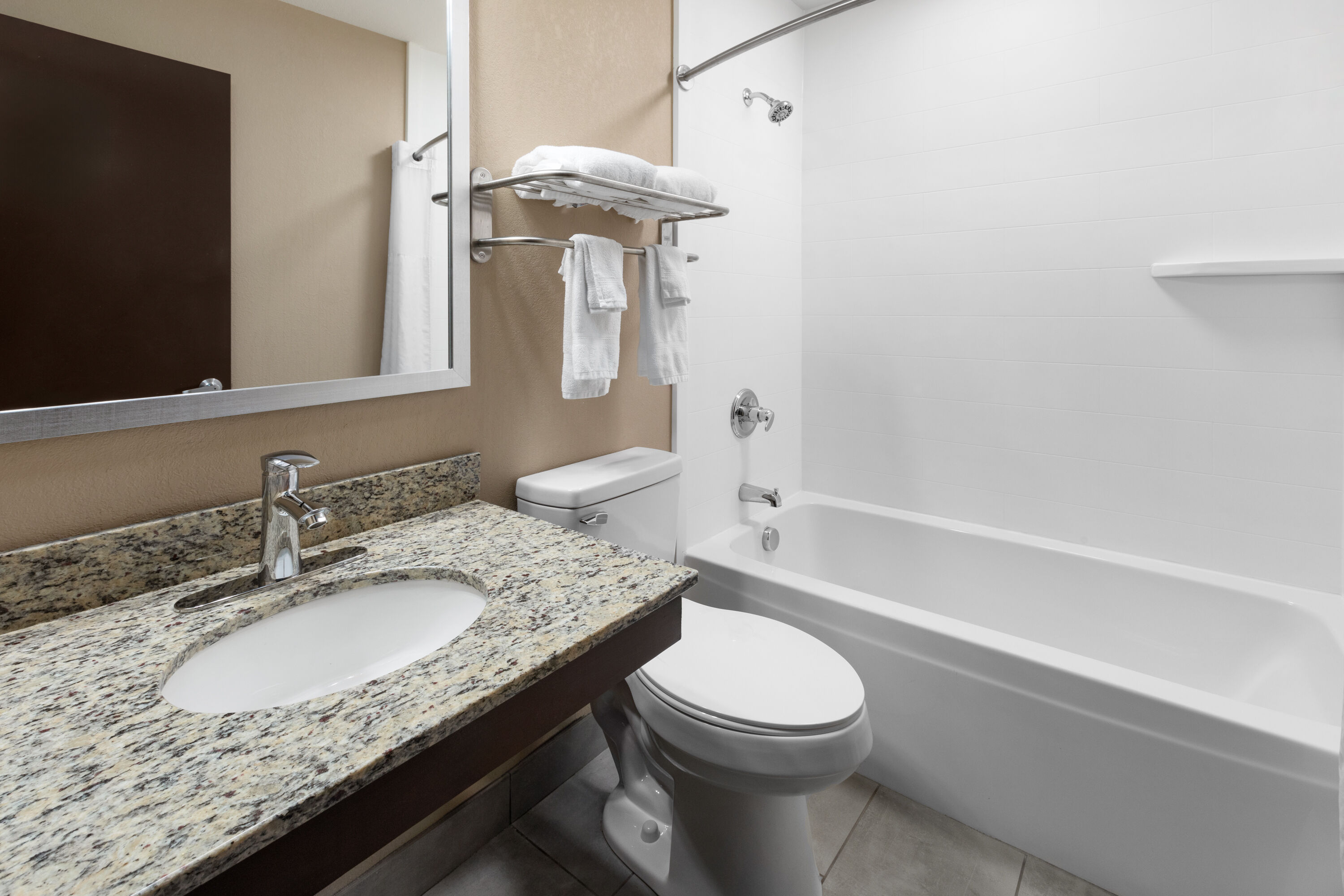 Guest room bath at the Super 8 by Wyndham Fairmont in Fairmont, West Virginia