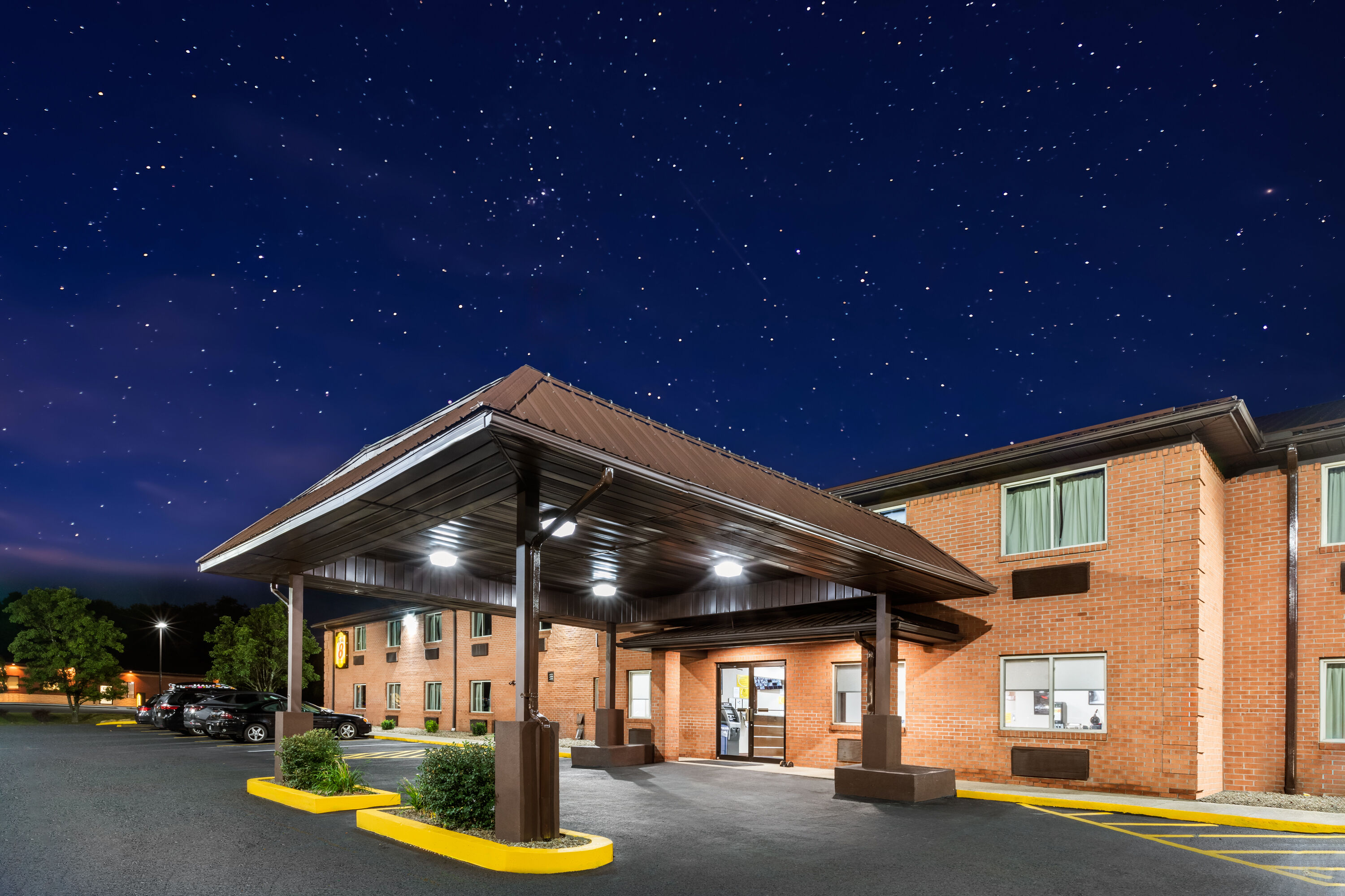 Exterior Dusk Image of Super 8 by Wyndham Fairmont hotel in Fairmont, West Virginia