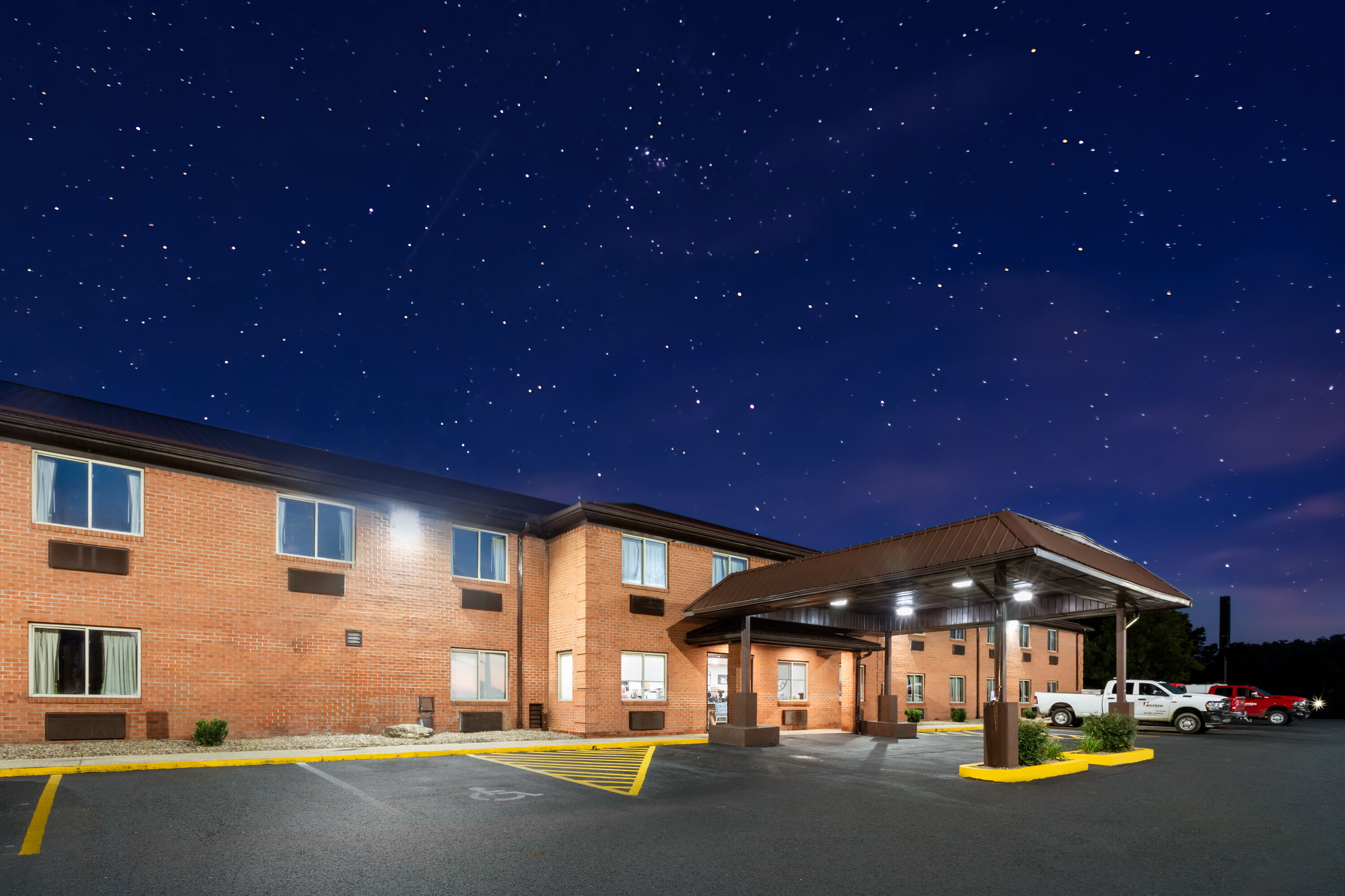 Exterior Dusk Image of Super 8 by Wyndham Fairmont hotel in Fairmont, West Virginia