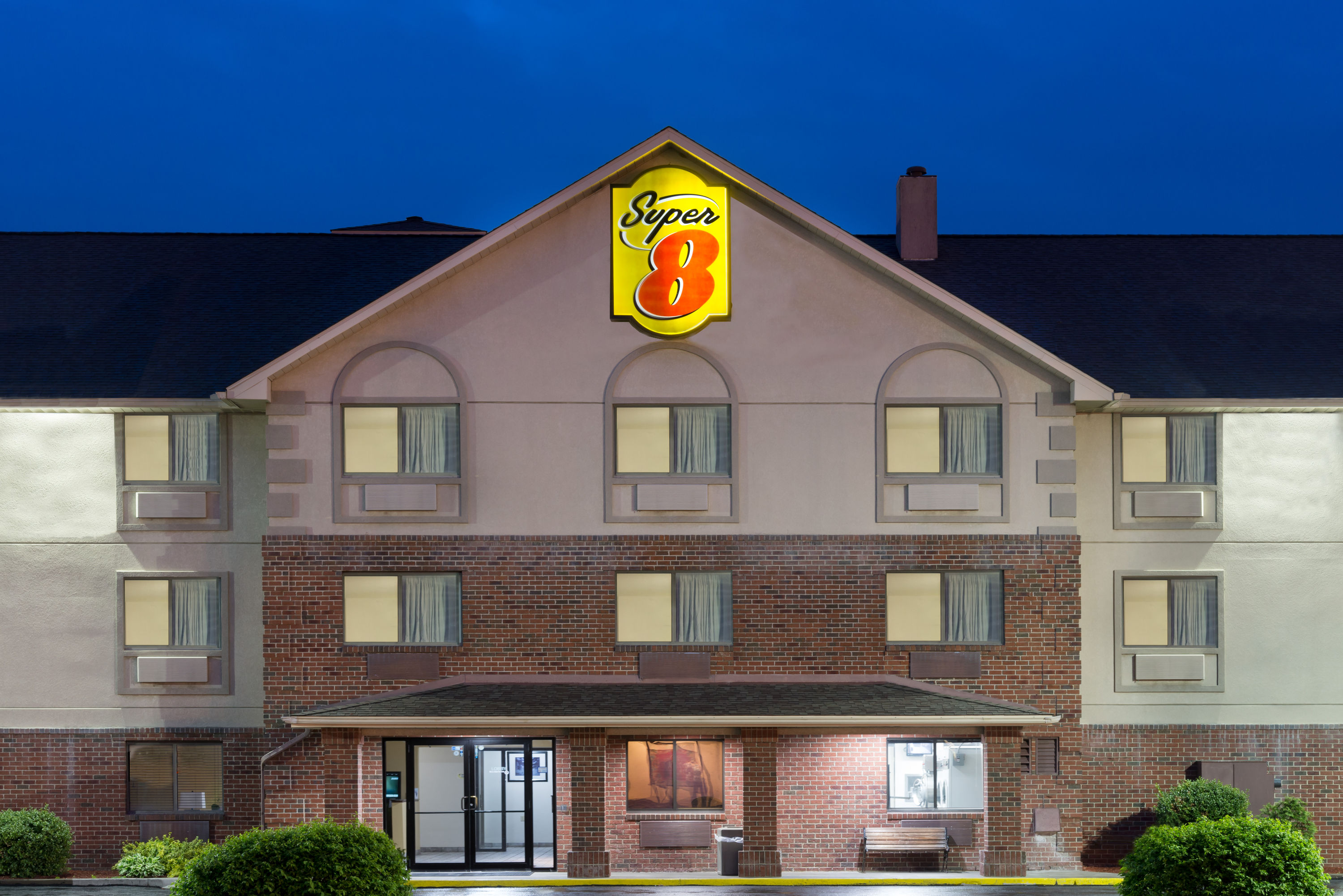 Exterior Dusk Image of Super 8 by Wyndham Morgantown hotel in Morgantown, West Virginia