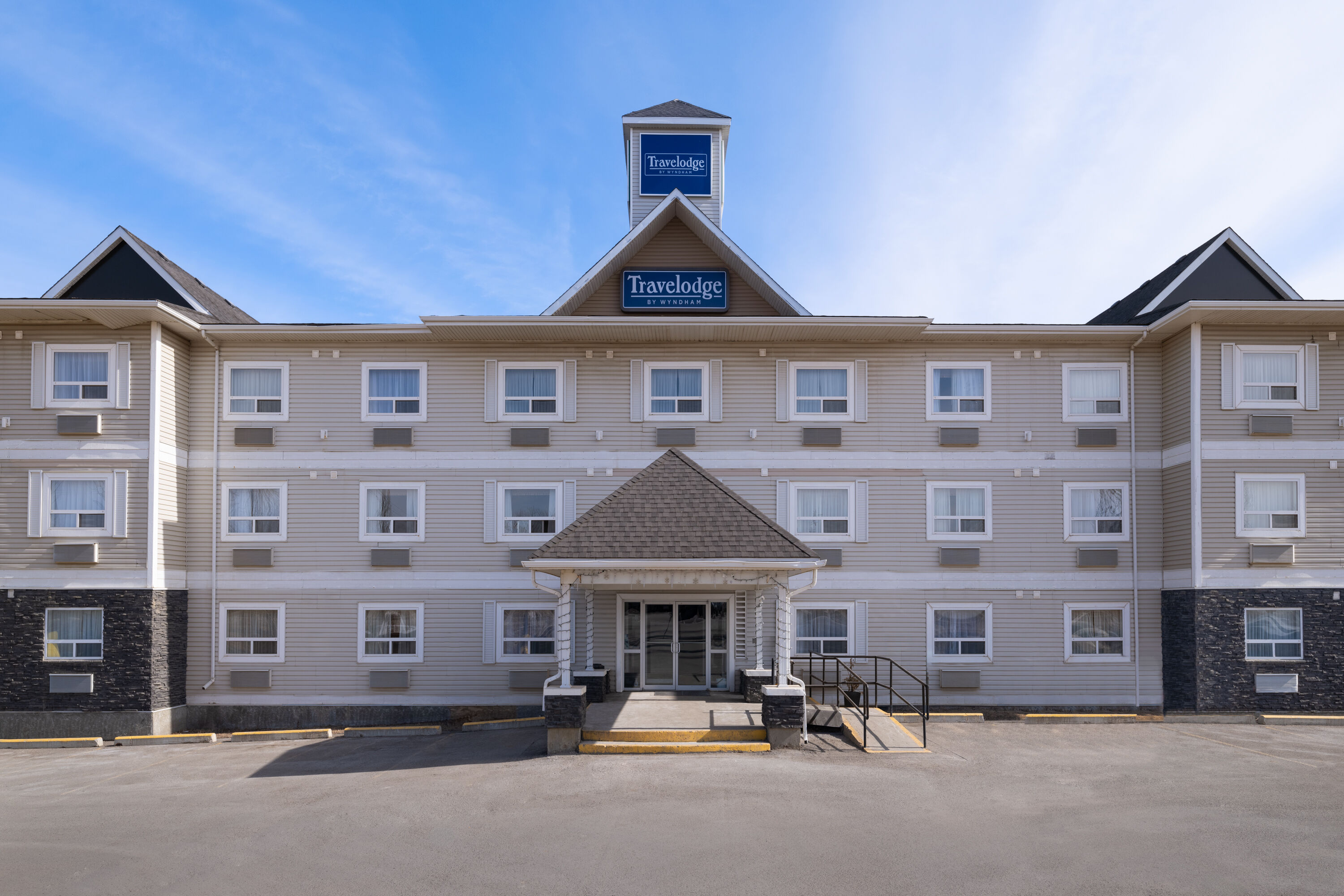 Exterior Day Image of Travelodge by Wyndham Fort McMurray hotel in Fort McMurray, Alberta