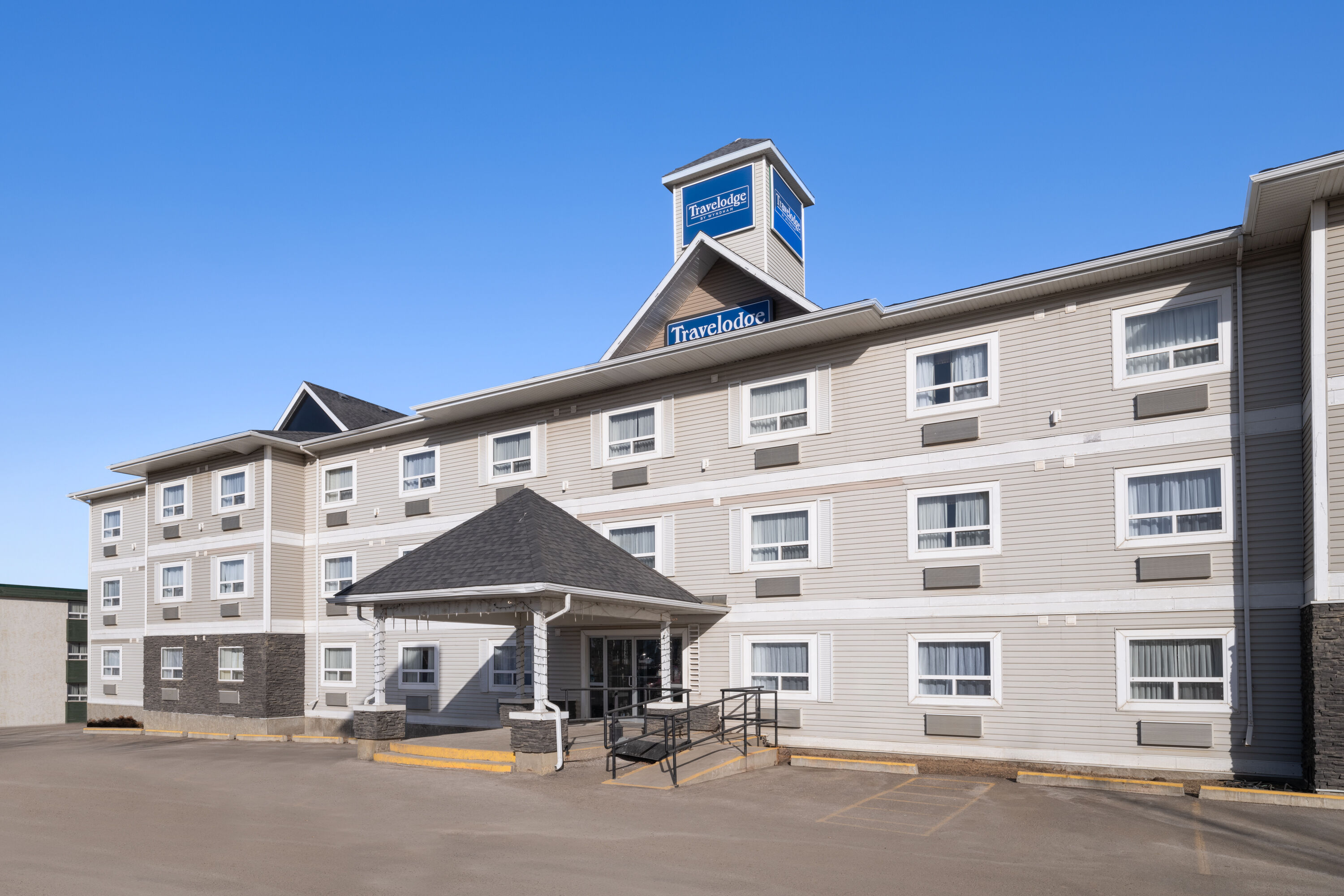 Exterior Day Image of Travelodge by Wyndham Fort McMurray hotel in Fort McMurray, Alberta