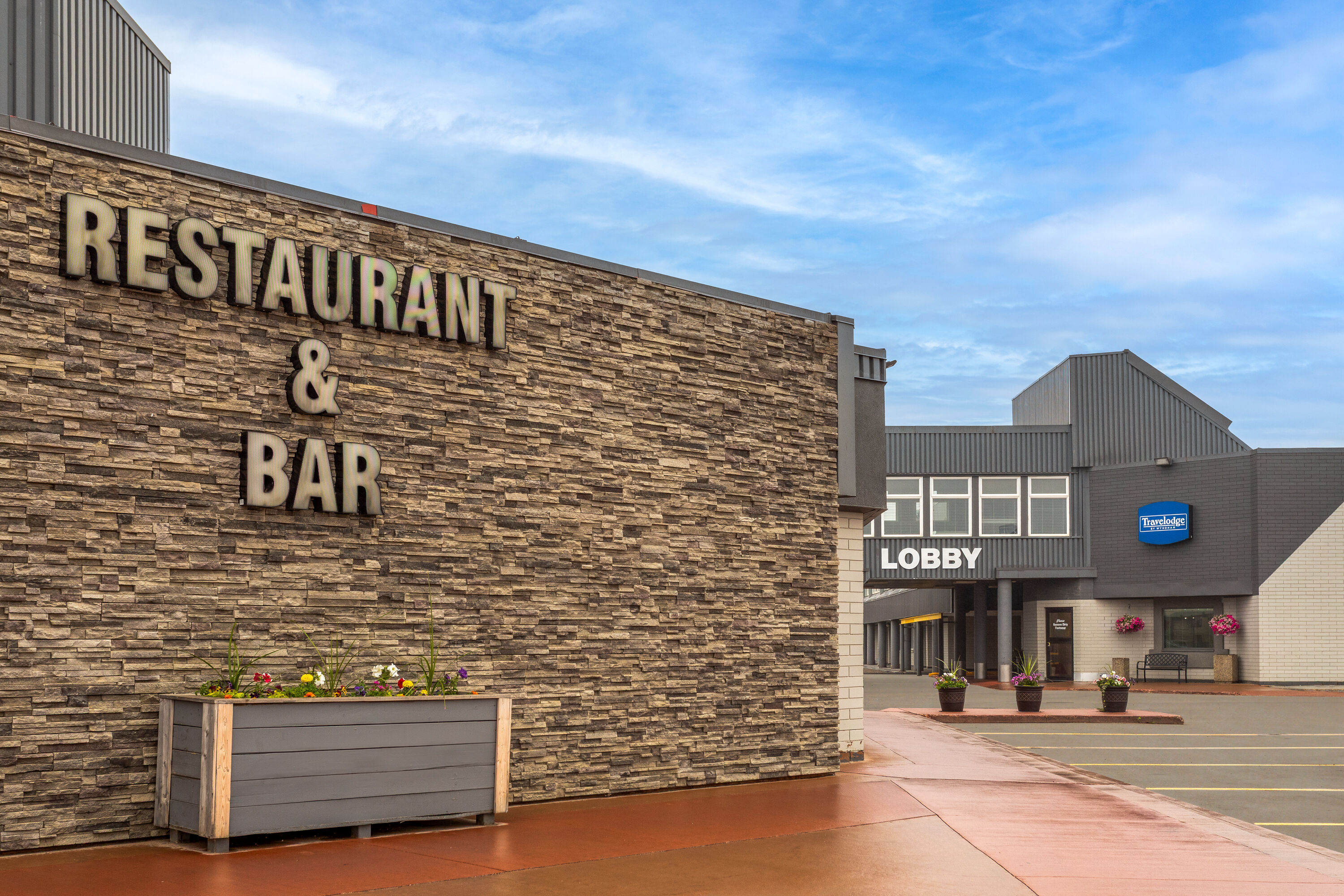 Exterior Day Image of Travelodge by Wyndham Grande Prairie hotel in Grande Prairie, Alberta