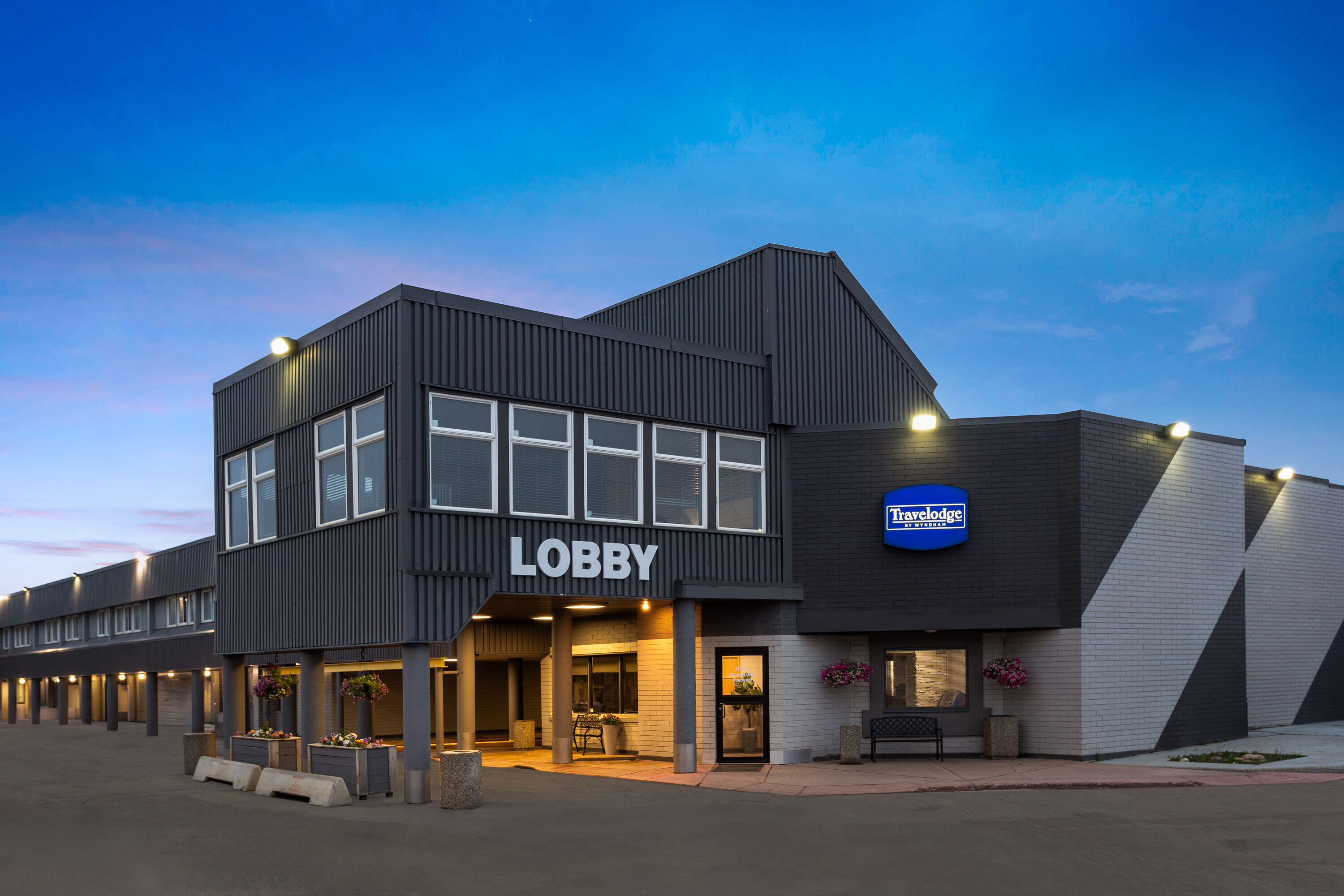 Exterior Dusk Image of Travelodge by Wyndham Grande Prairie hotel in Grande Prairie, Alberta