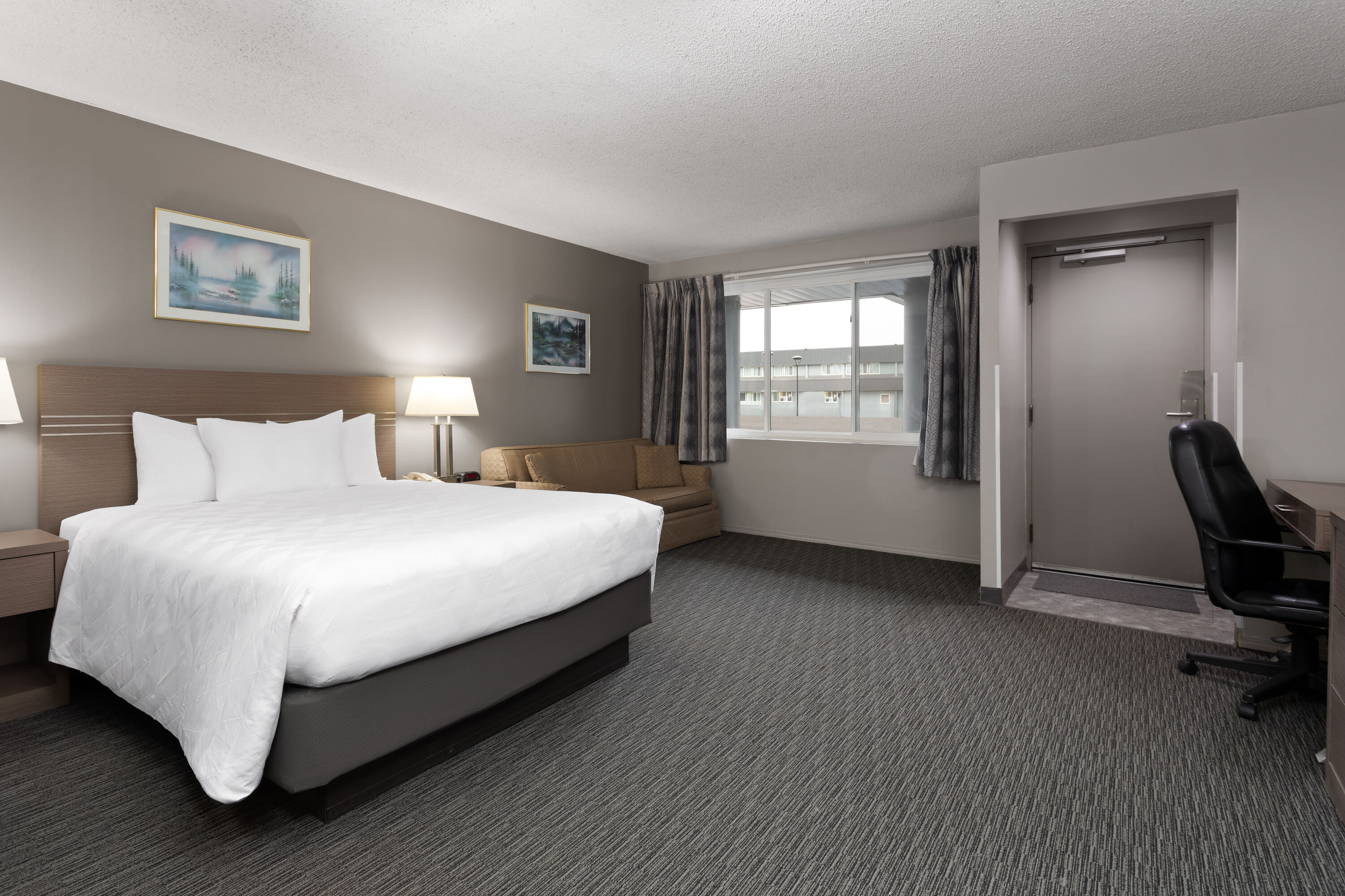 Guest room at the Travelodge by Wyndham Grande Prairie in Grande Prairie, Alberta