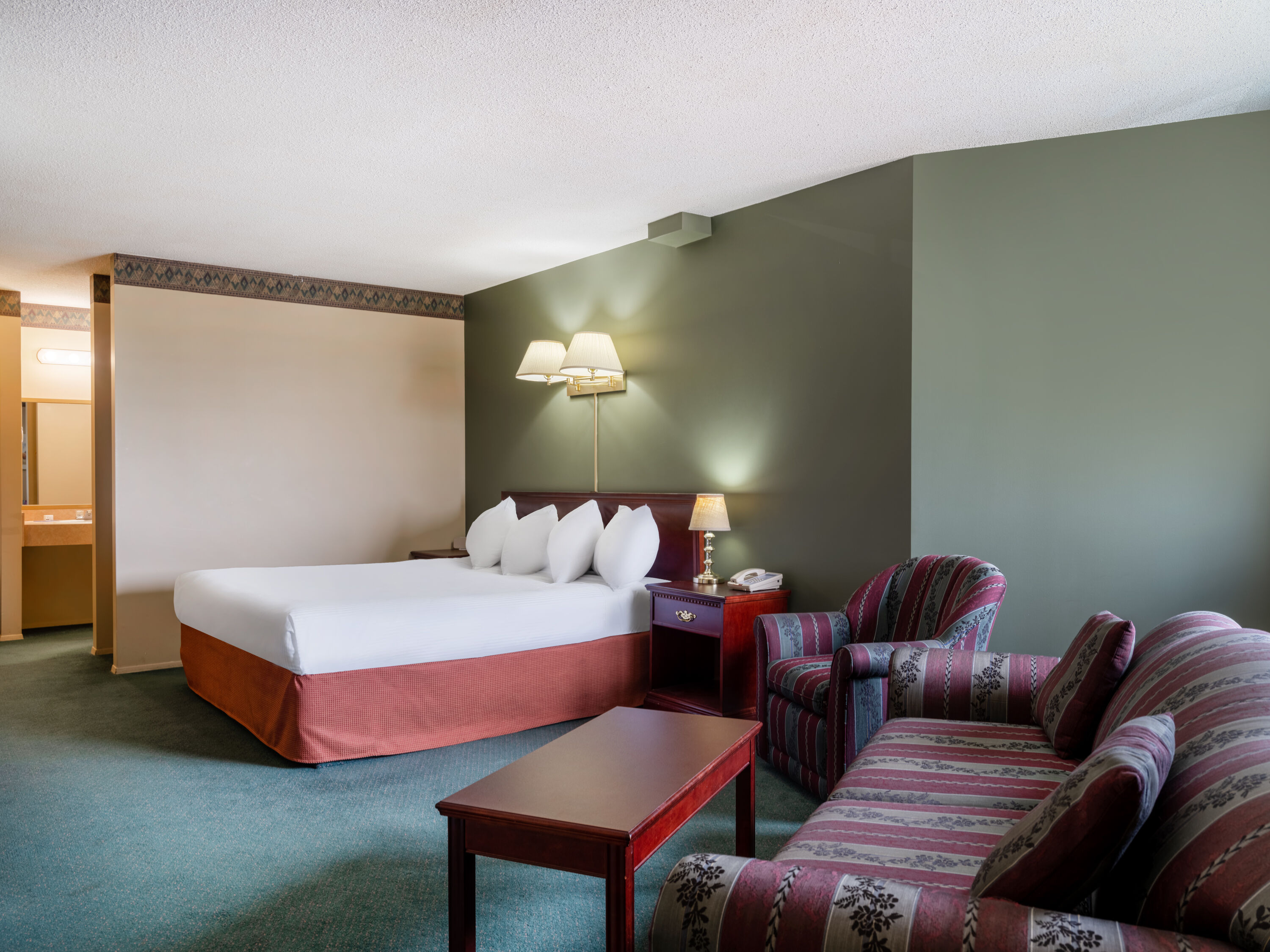 Guest room at the Travelodge by Wyndham Lacombe in Lacombe, Alberta