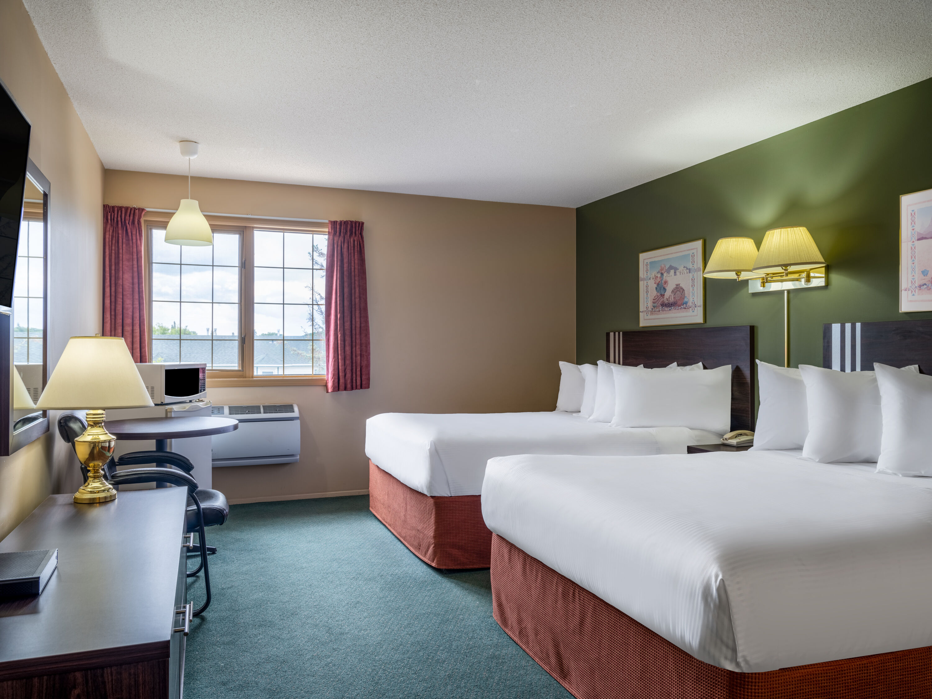 Guest room at the Travelodge by Wyndham Lacombe in Lacombe, Alberta