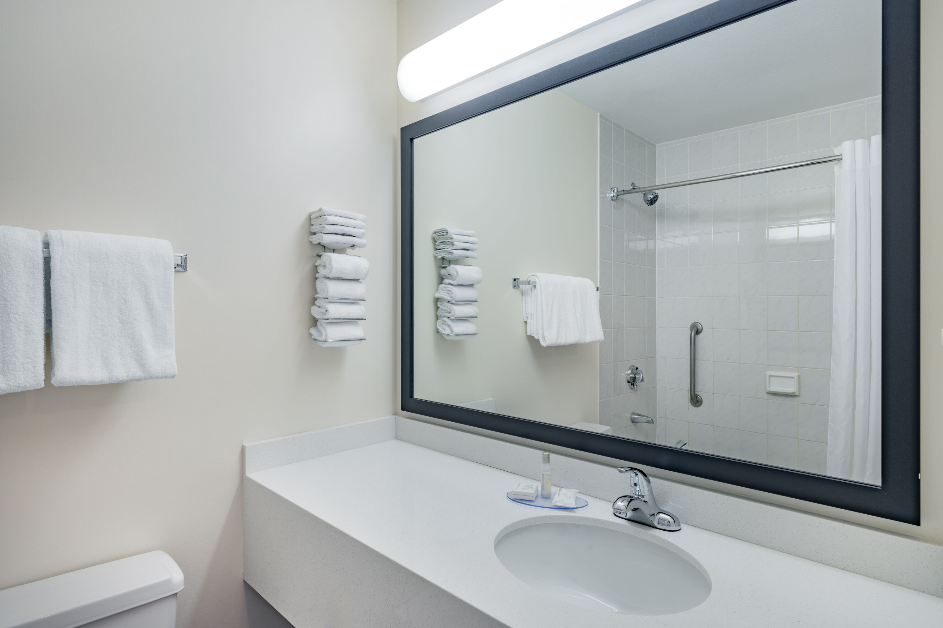 Guest room bath at the Travelodge by Wyndham Fort St John in Fort St. John, British Columbia