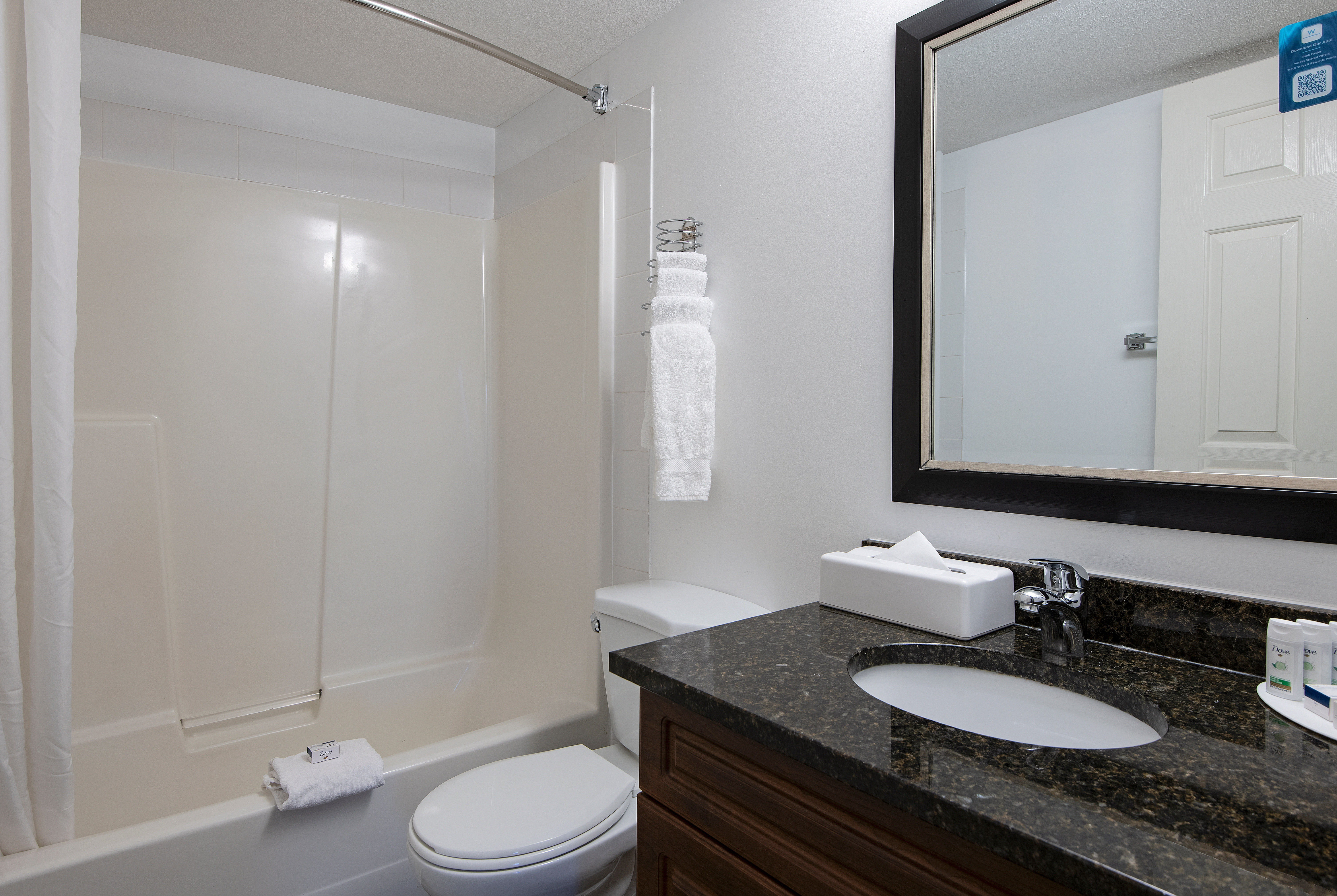 Guest room bath at the Travelodge by Wyndham Kamloops Mountview in Kamloops, British Columbia