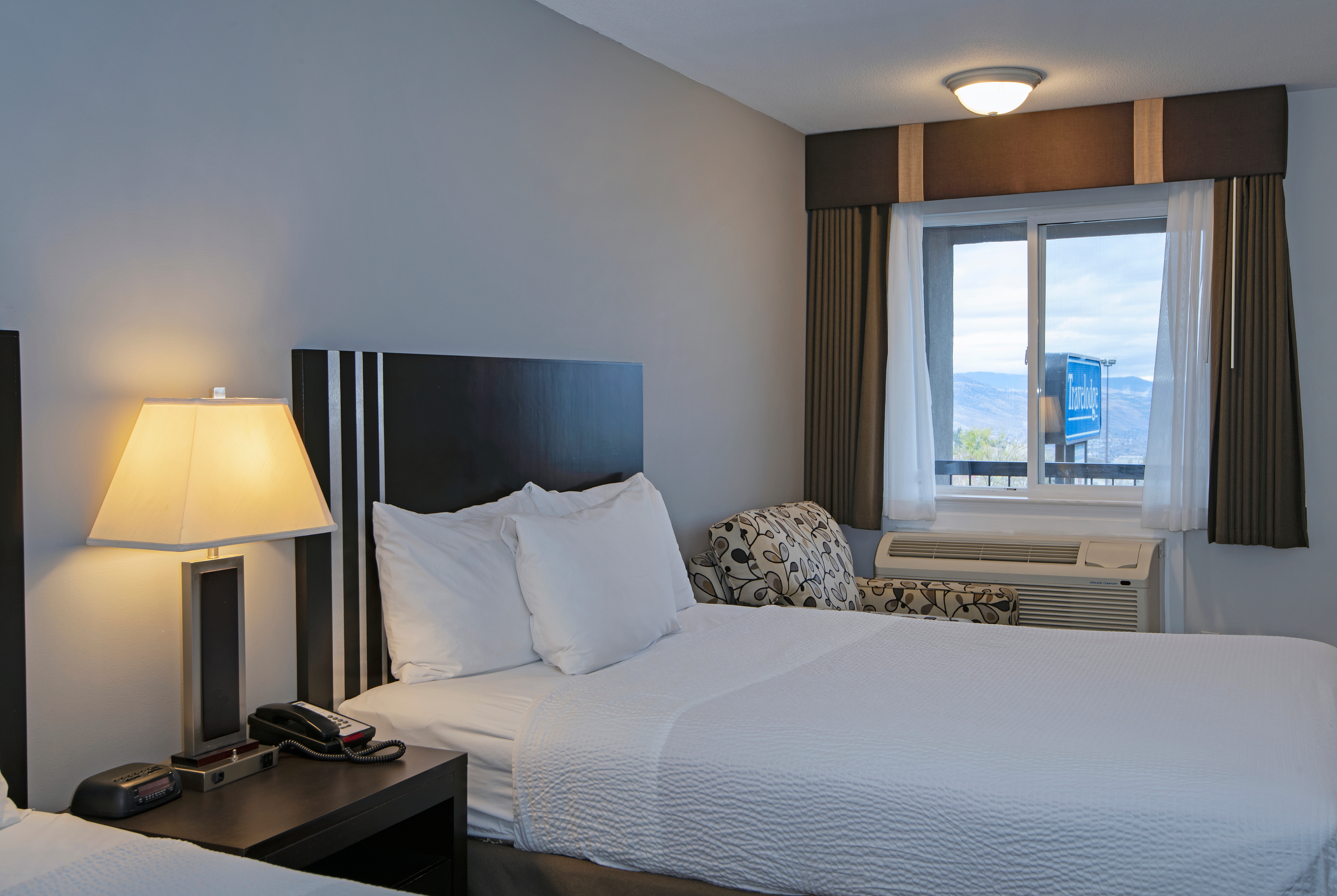 Guest room at the Travelodge by Wyndham Kamloops Mountview in Kamloops, British Columbia