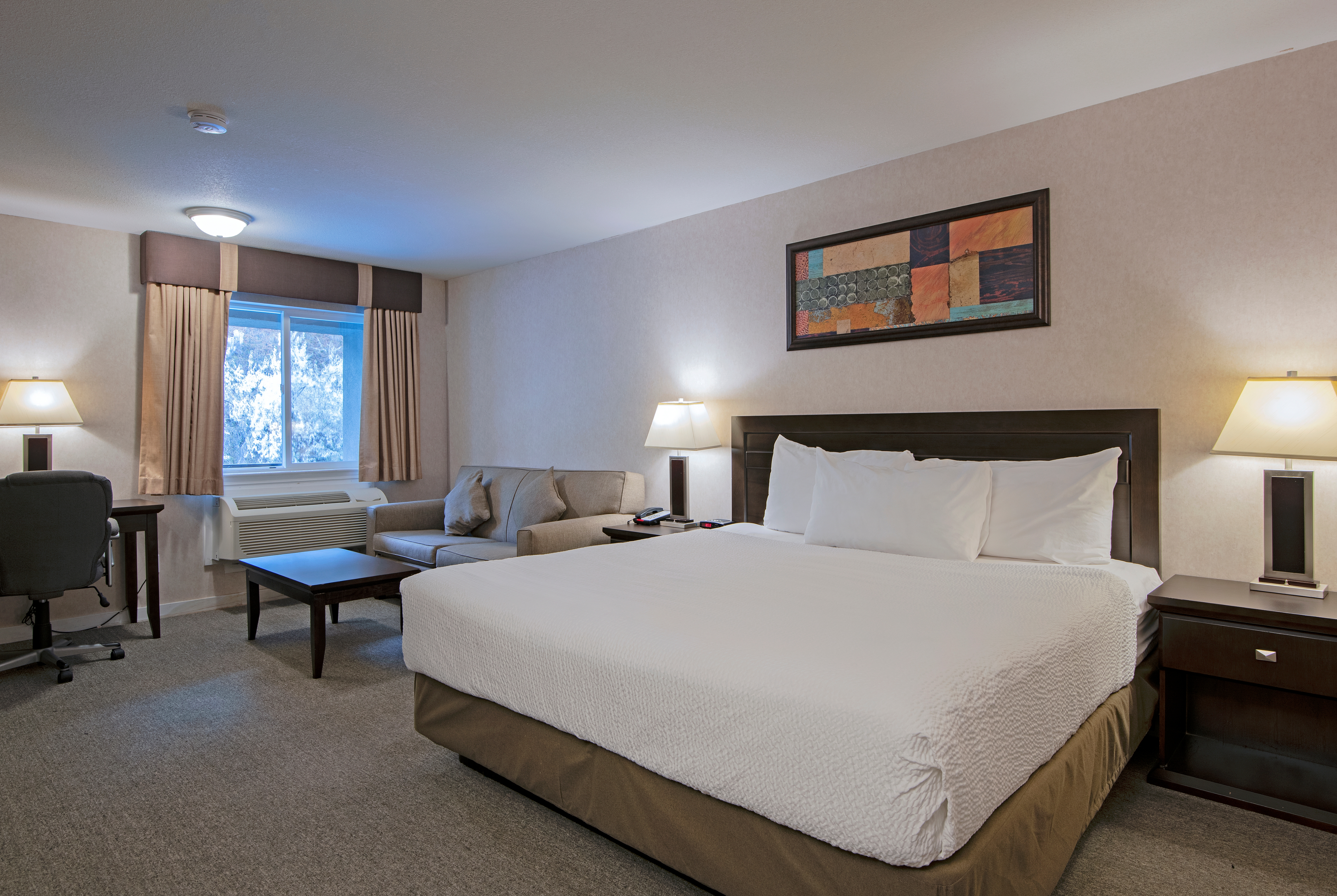 Guest room at the Travelodge by Wyndham Kamloops Mountview in Kamloops, British Columbia