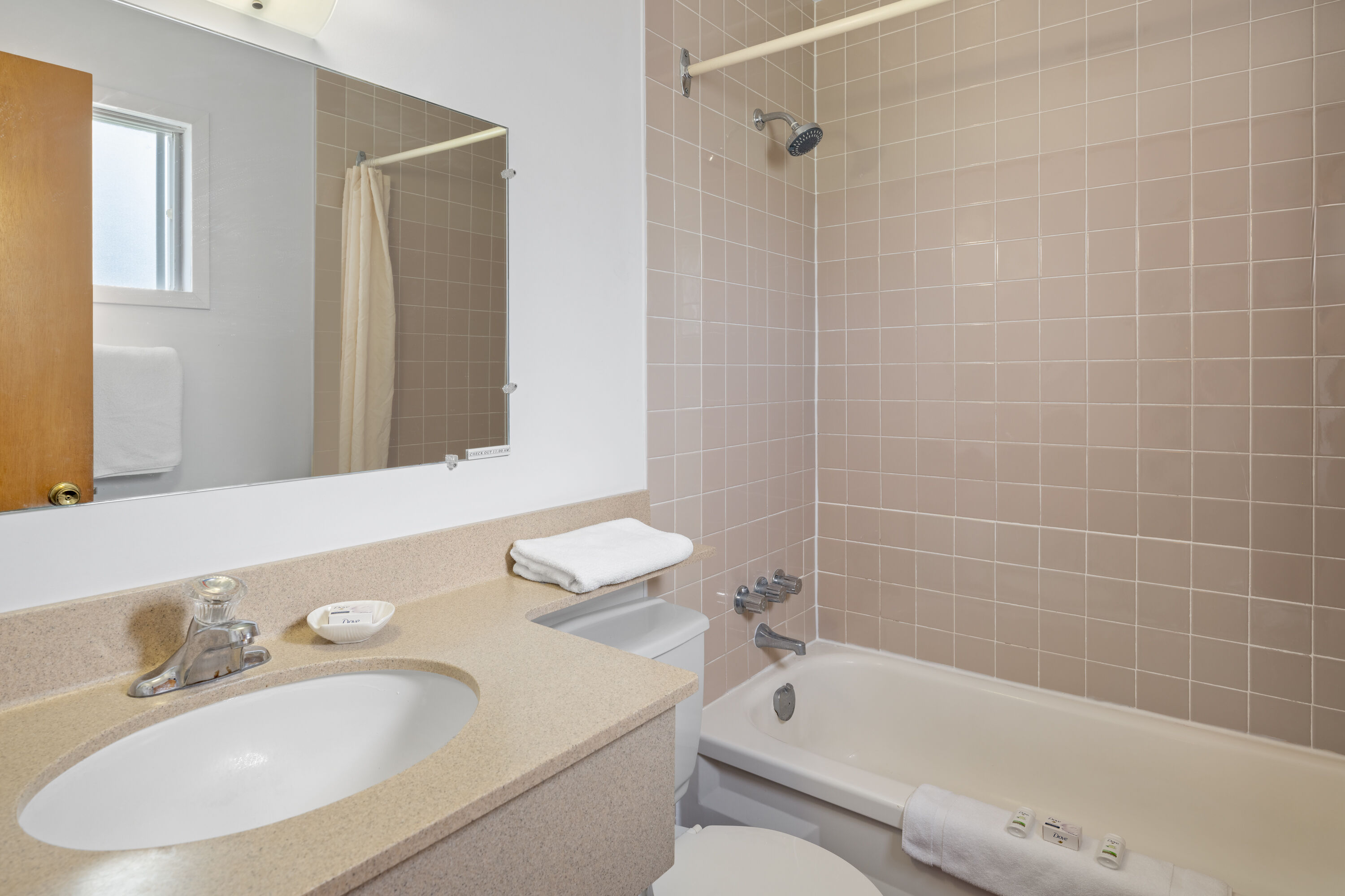 Guest room bath at the Travelodge by Wyndham Grand Falls in Saint Andre, New Brunswick