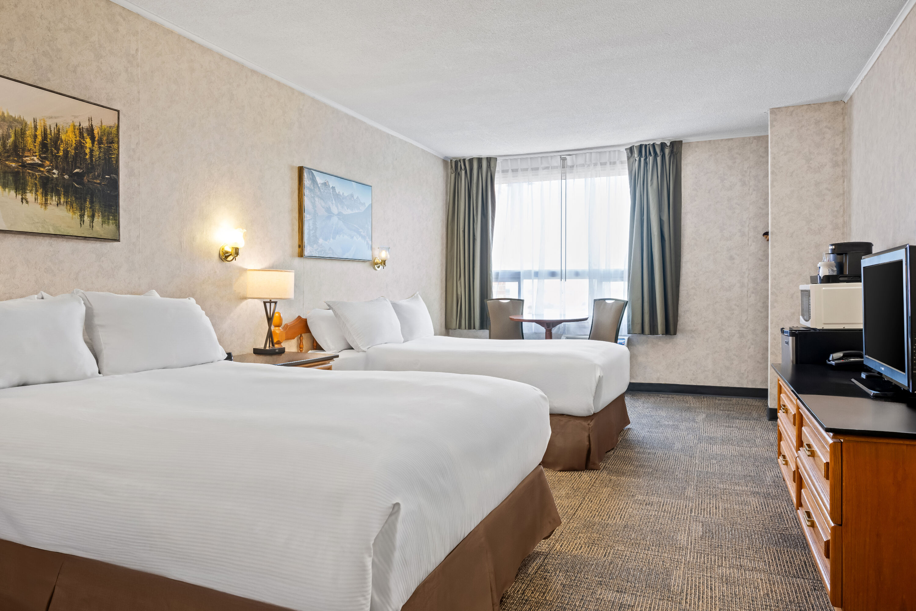 Double bed guest room at the Travelodge by Wyndham Amherst in Amherst, Nova Scotia