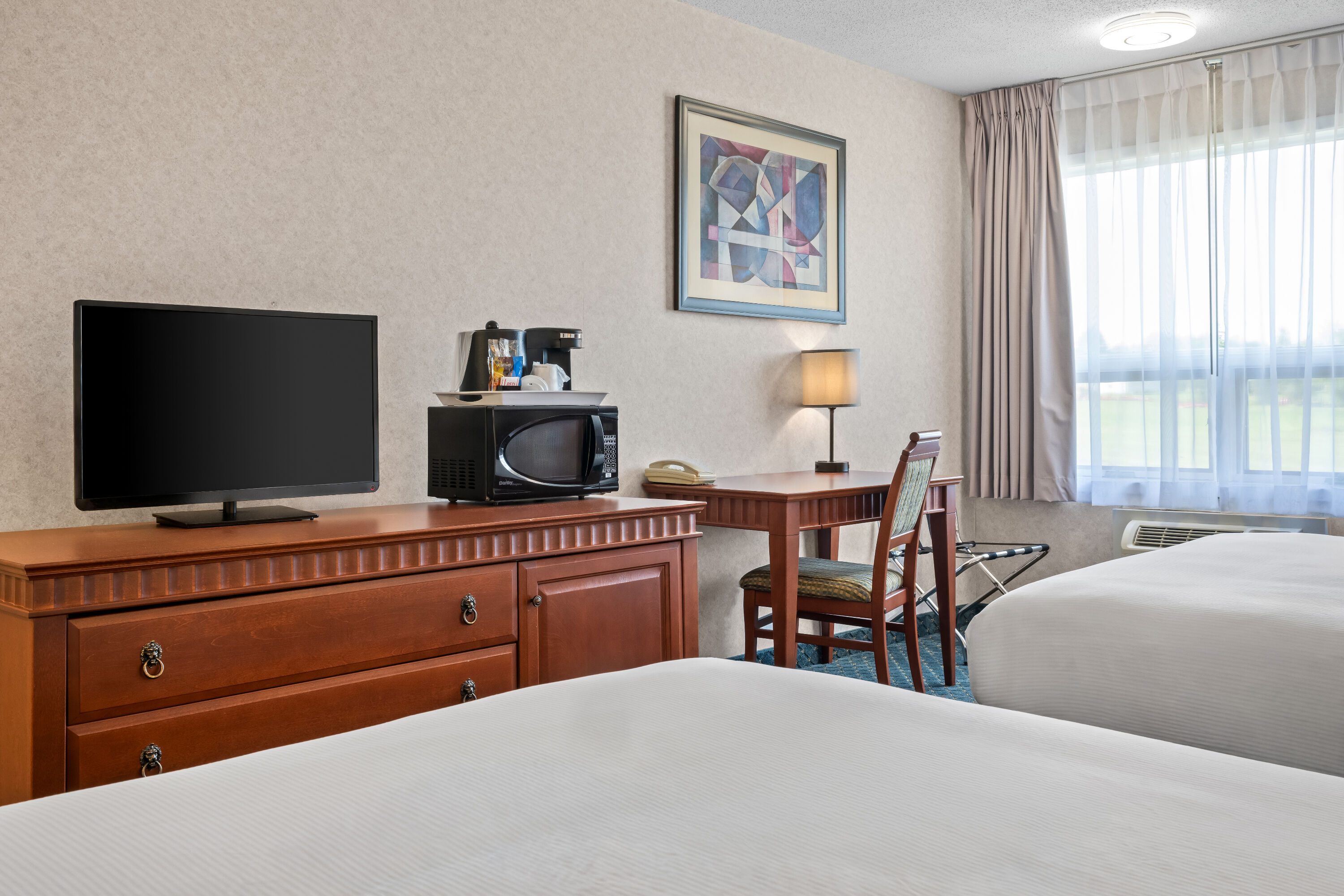 Double bed guest room at the Travelodge by Wyndham Amherst in Amherst, Nova Scotia