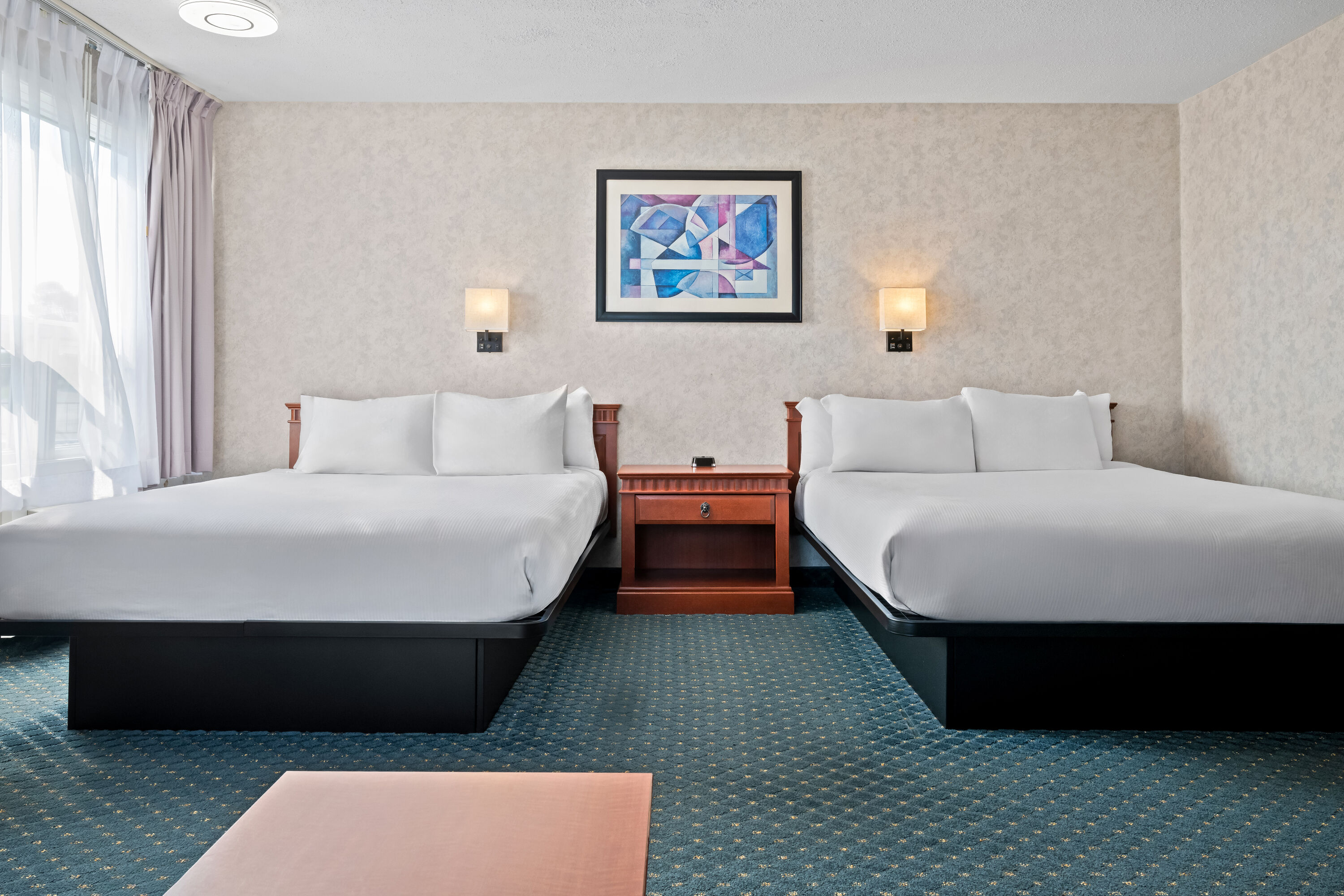 Double bed guest room at the Travelodge by Wyndham Amherst in Amherst, Nova Scotia