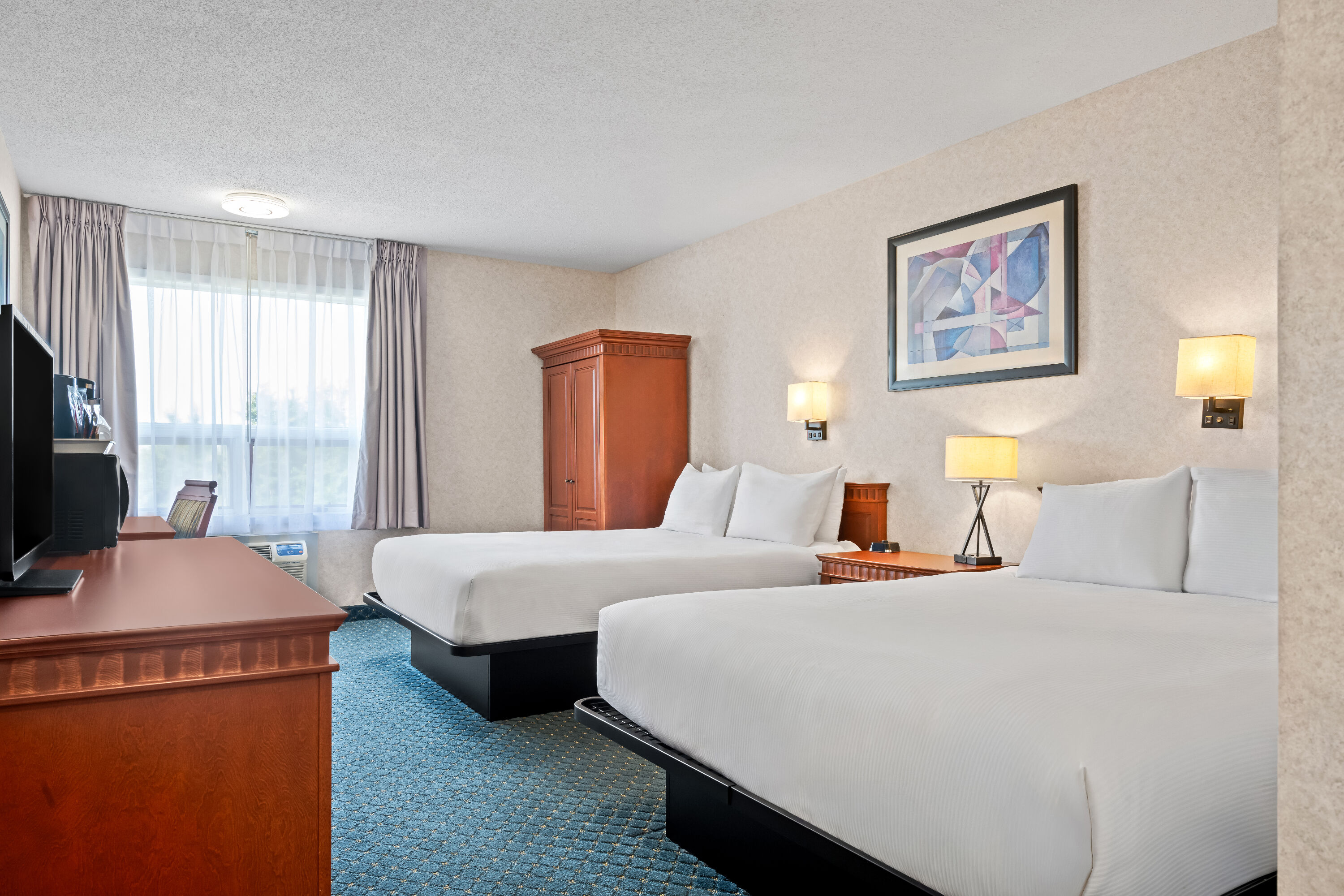Double bed guest room at the Travelodge by Wyndham Amherst in Amherst, Nova Scotia