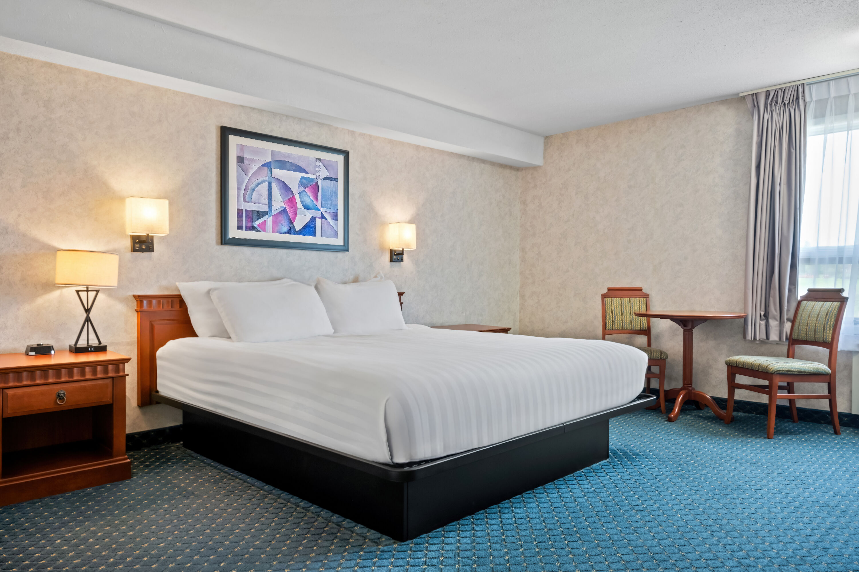 King bed guest room at the Travelodge by Wyndham Amherst in Amherst, Nova Scotia