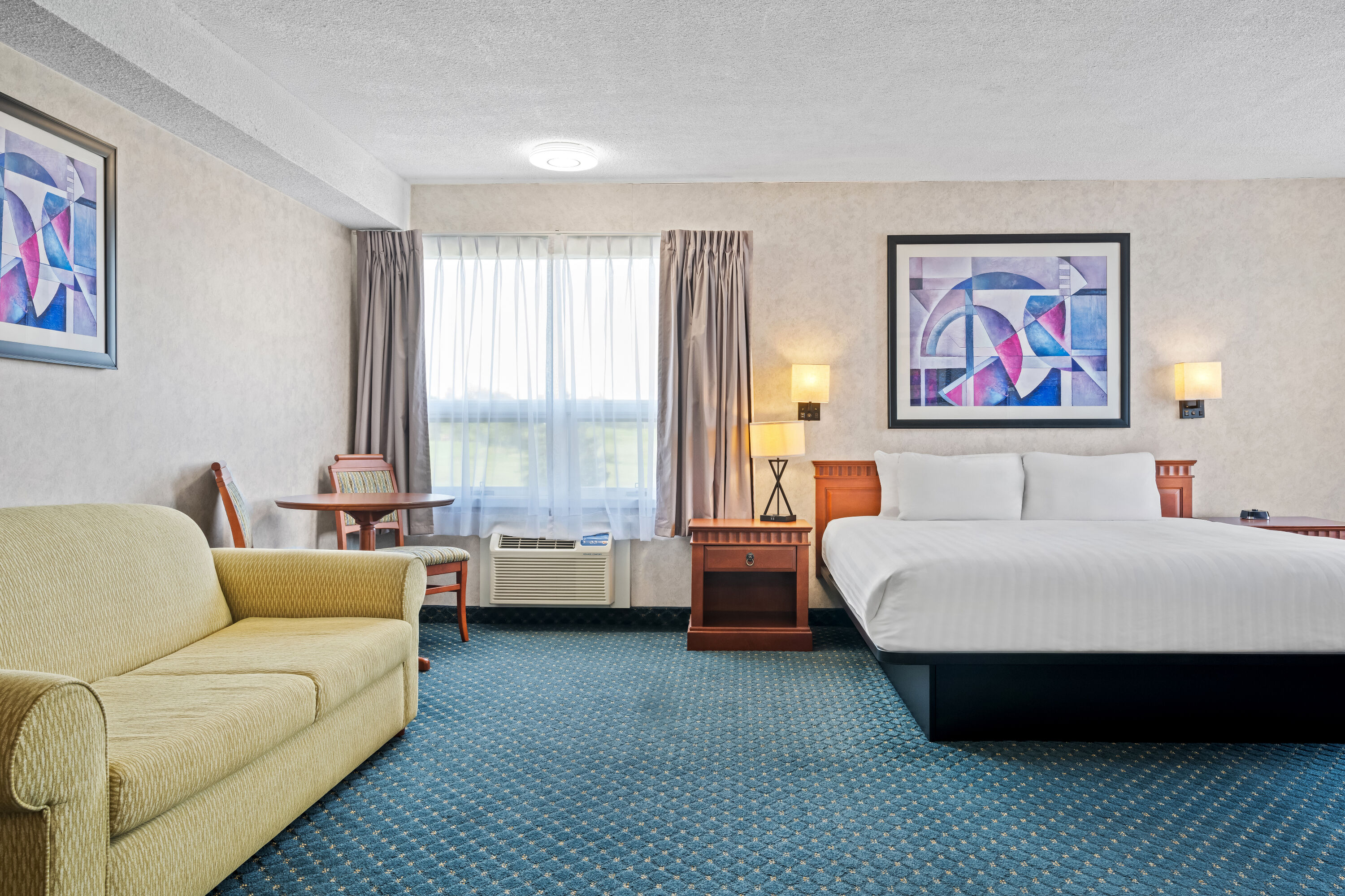 King bed guest room at the Travelodge by Wyndham Amherst in Amherst, Nova Scotia