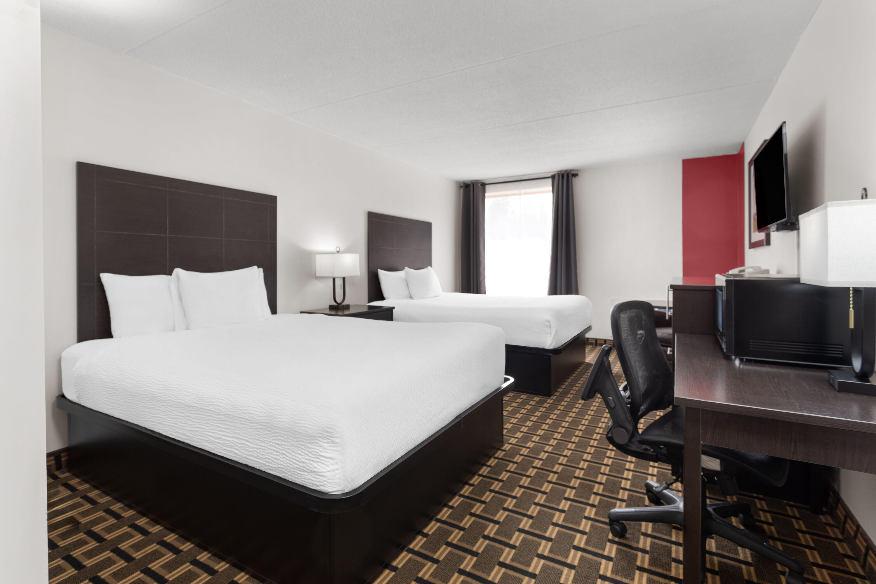 Guest room at the Travelodge by Wyndham Lindsay in Lindsay, Ontario