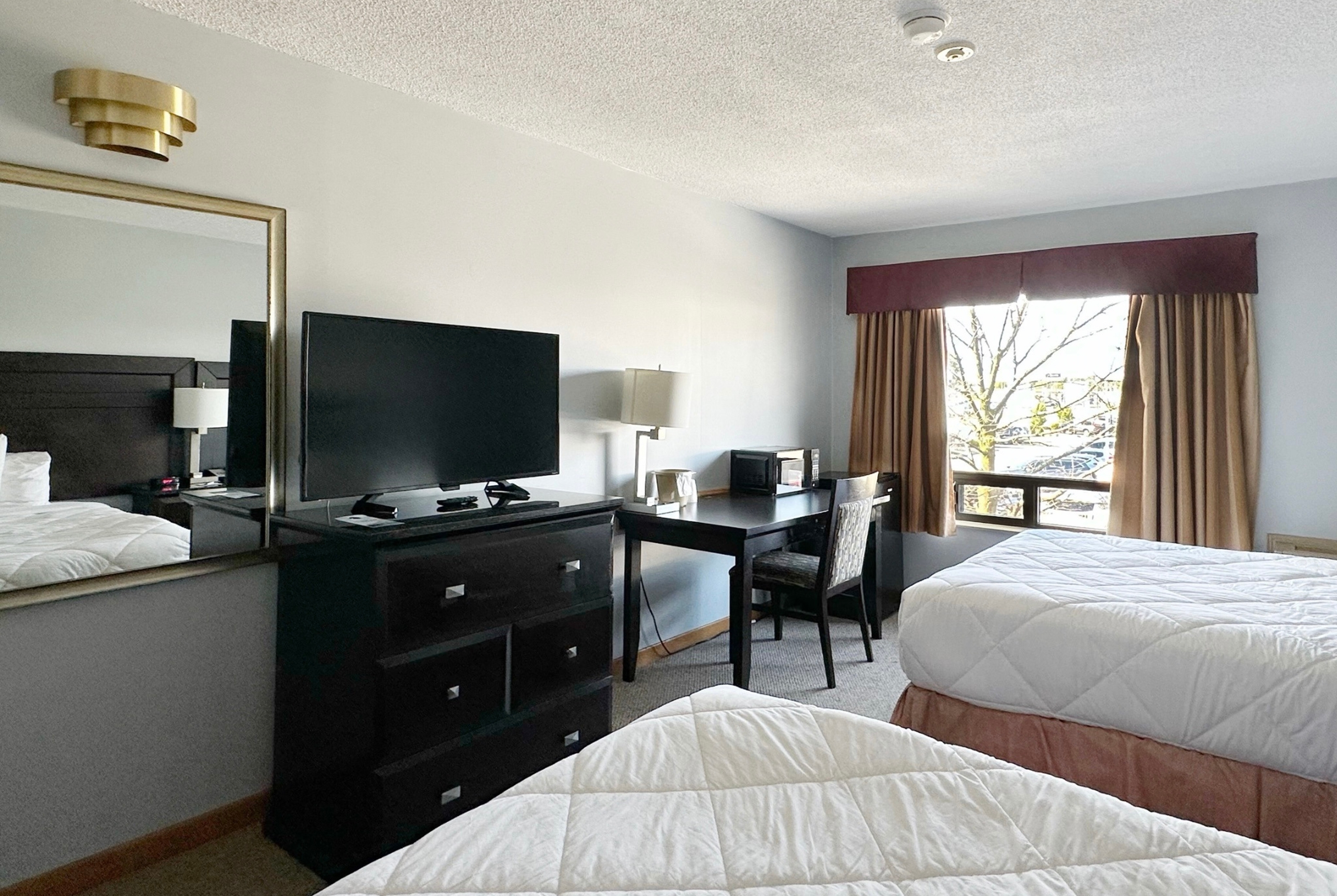 Guest room at the Travelodge by Wyndham Welland in Welland, Ontario