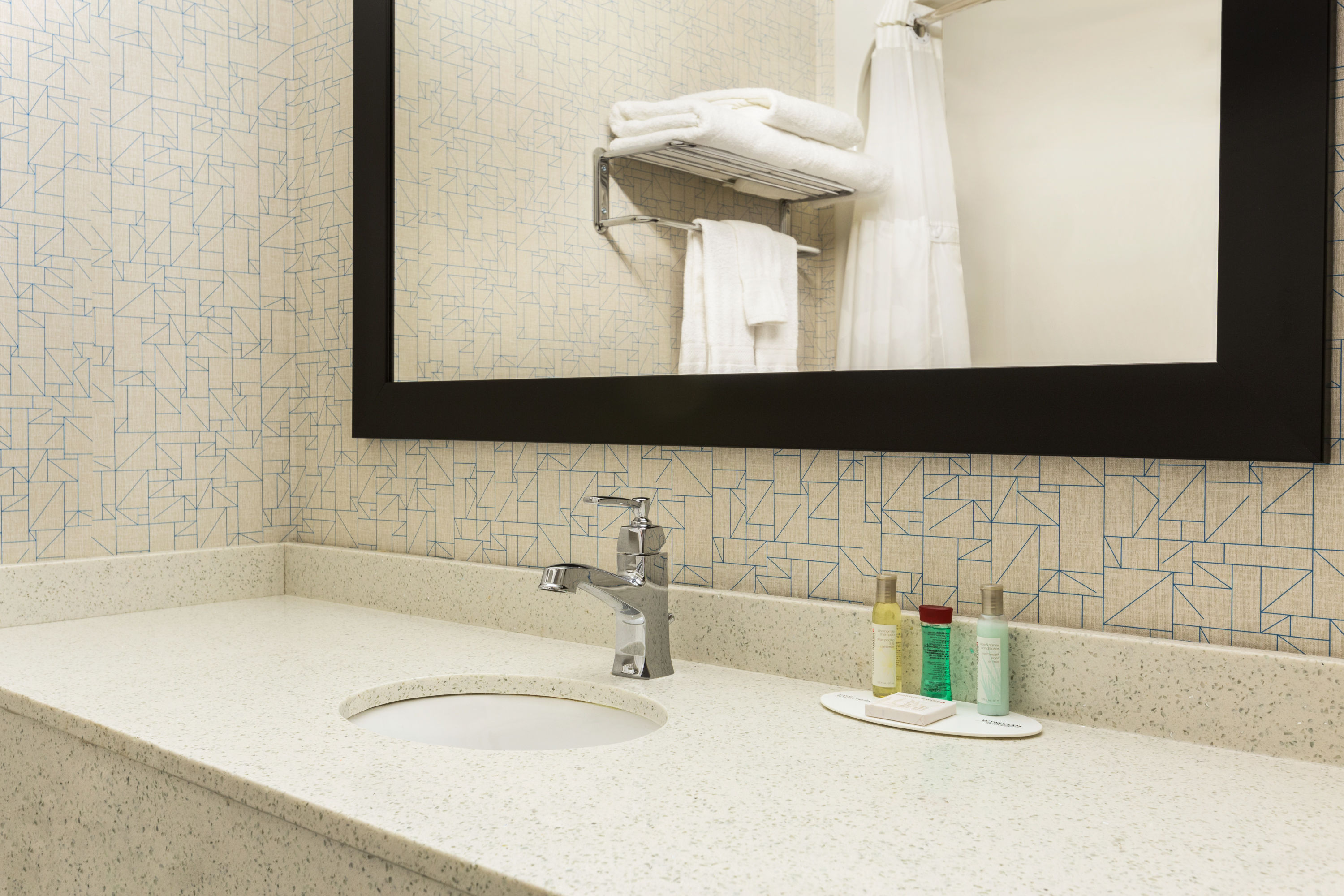 Guest room bath at the Travelodge by Wyndham Windsor in Windsor, Ontario