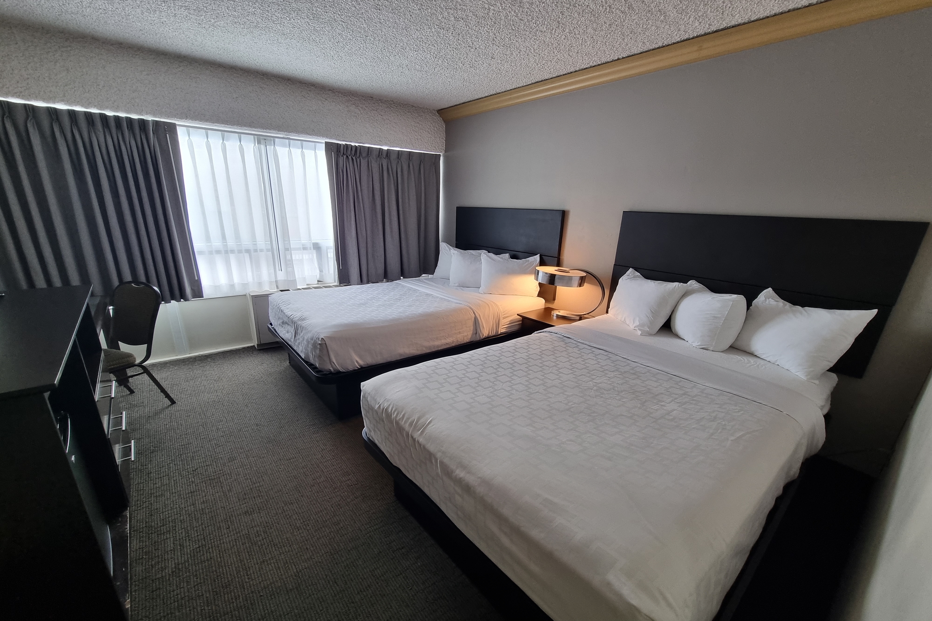 Guest room at the Travelodge by Wyndham Trois-Rivieres in Trois Rivieres, Quebec