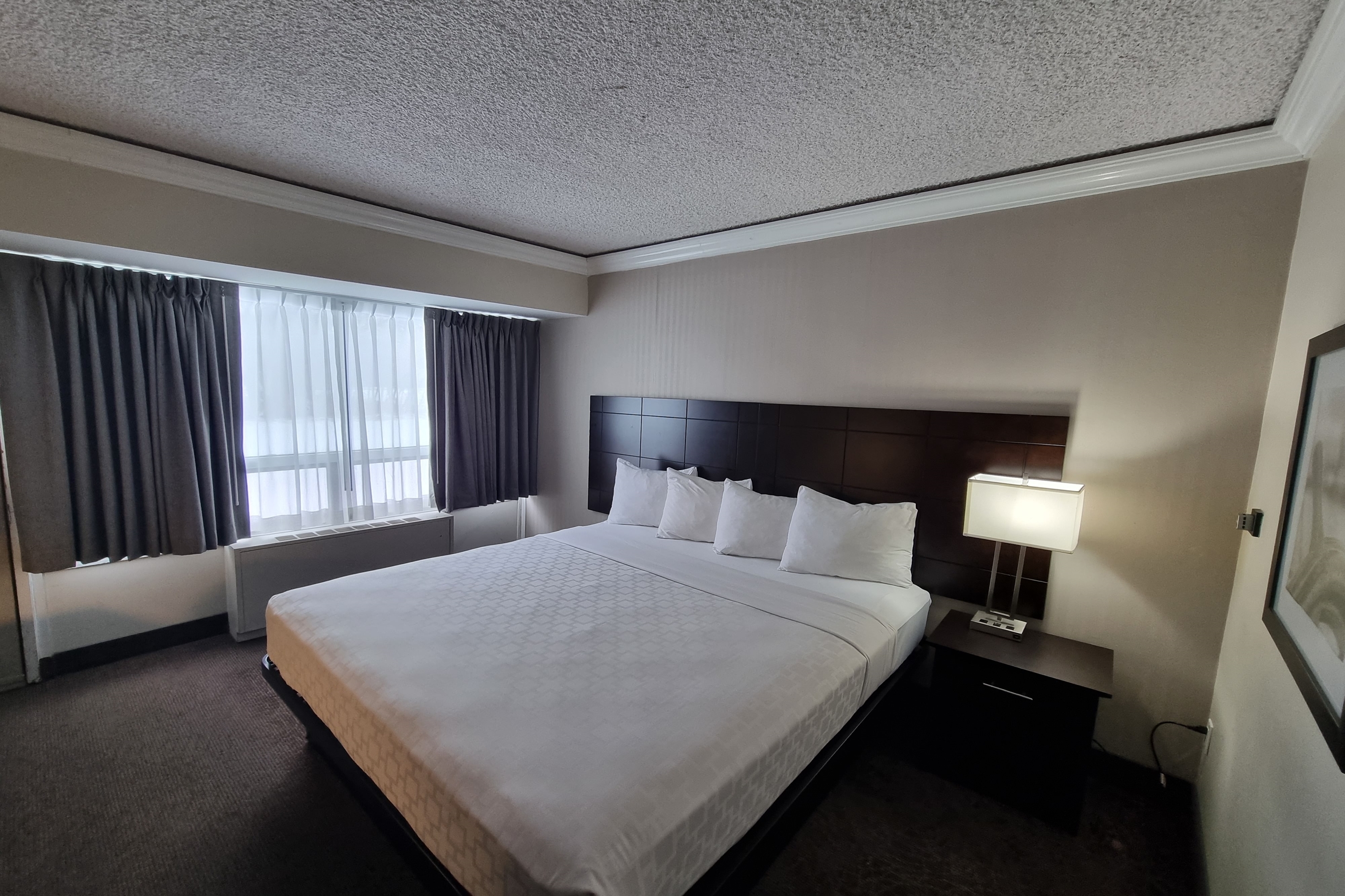 Guest room at the Travelodge by Wyndham Trois-Rivieres in Trois Rivieres, Quebec