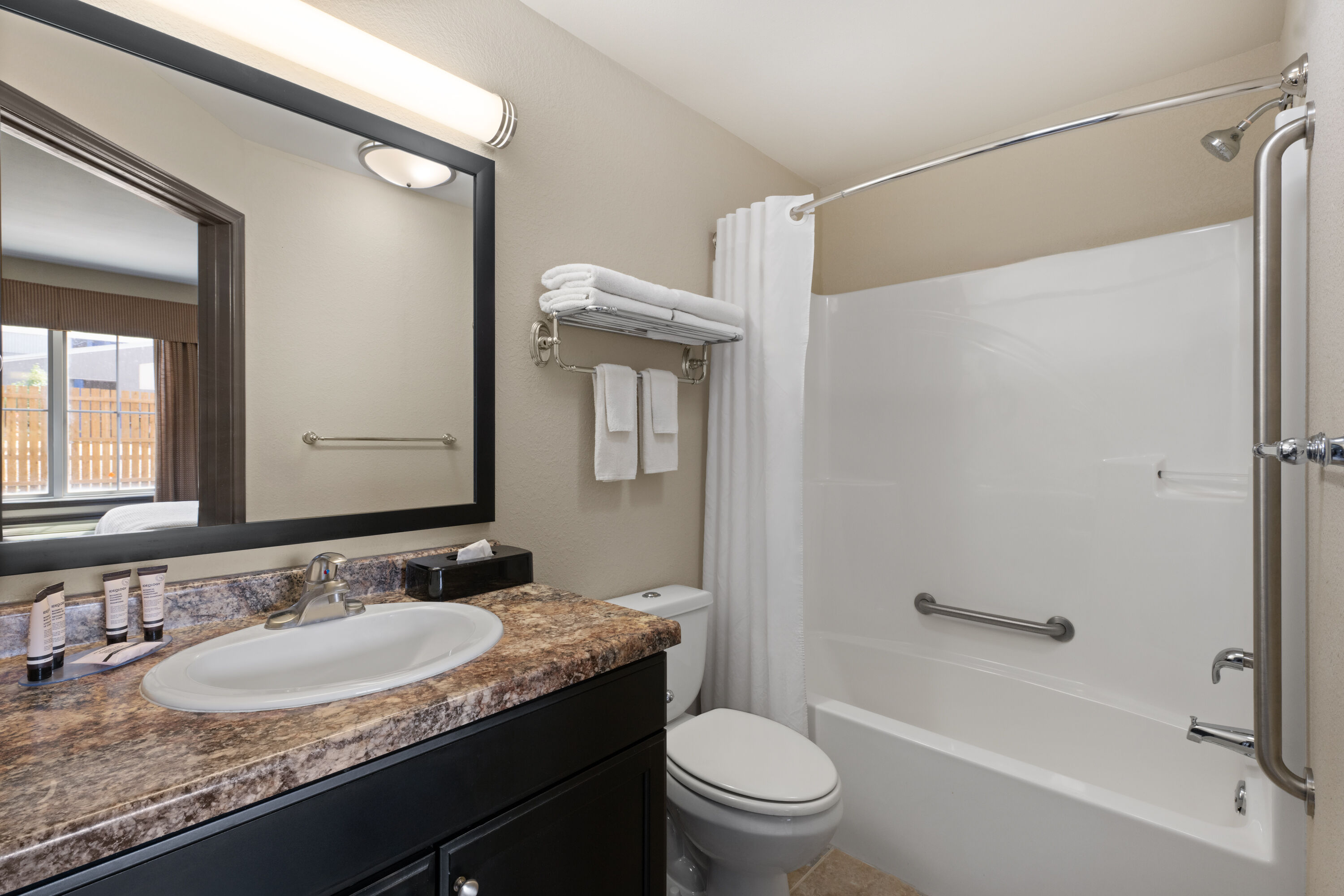 Guest room bath at the Travelodge Suites by Wyndham Estevan in Estevan, Saskatchewan