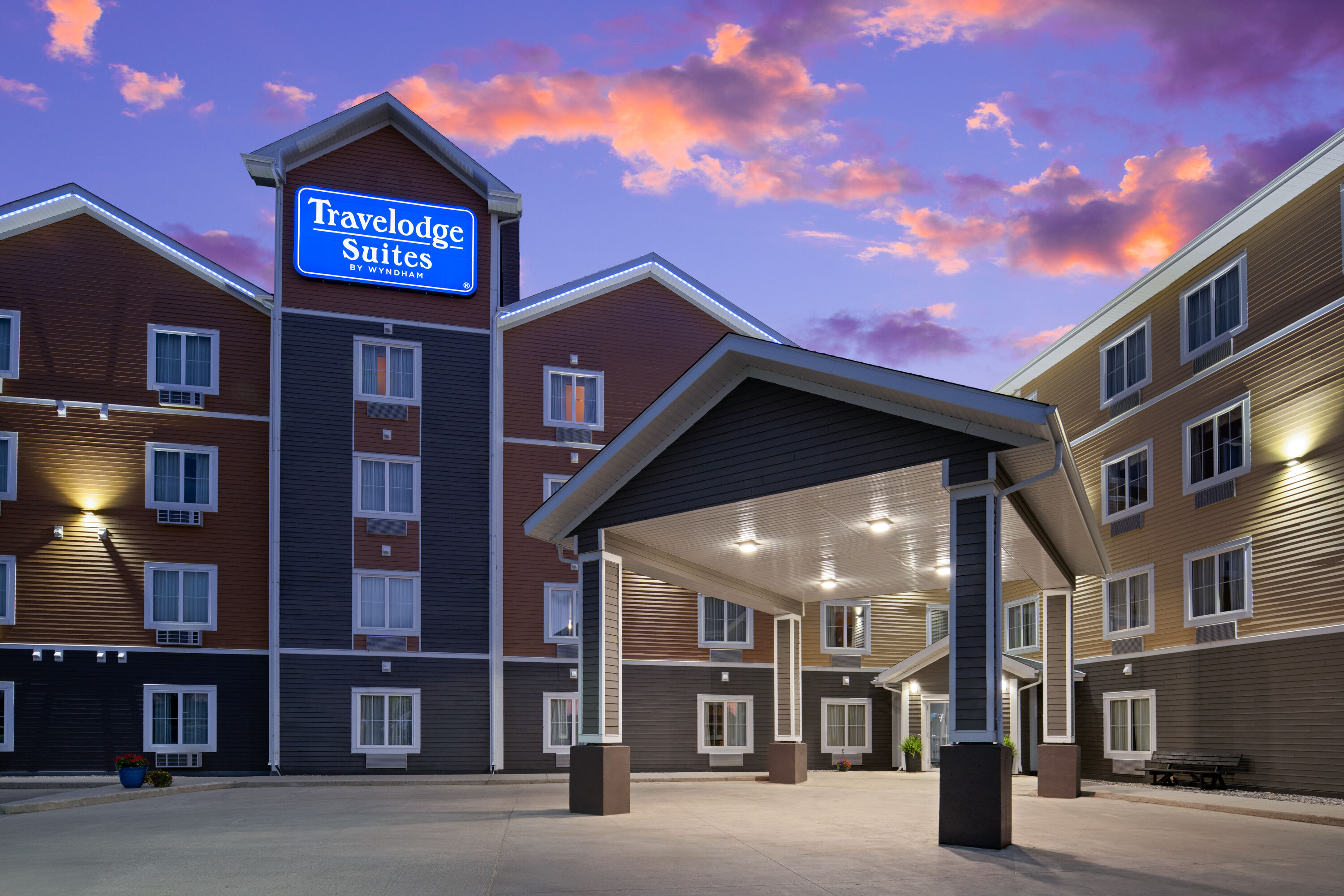 Exterior Dusk Image of Travelodge Suites by Wyndham Estevan hotel in Estevan, Saskatchewan