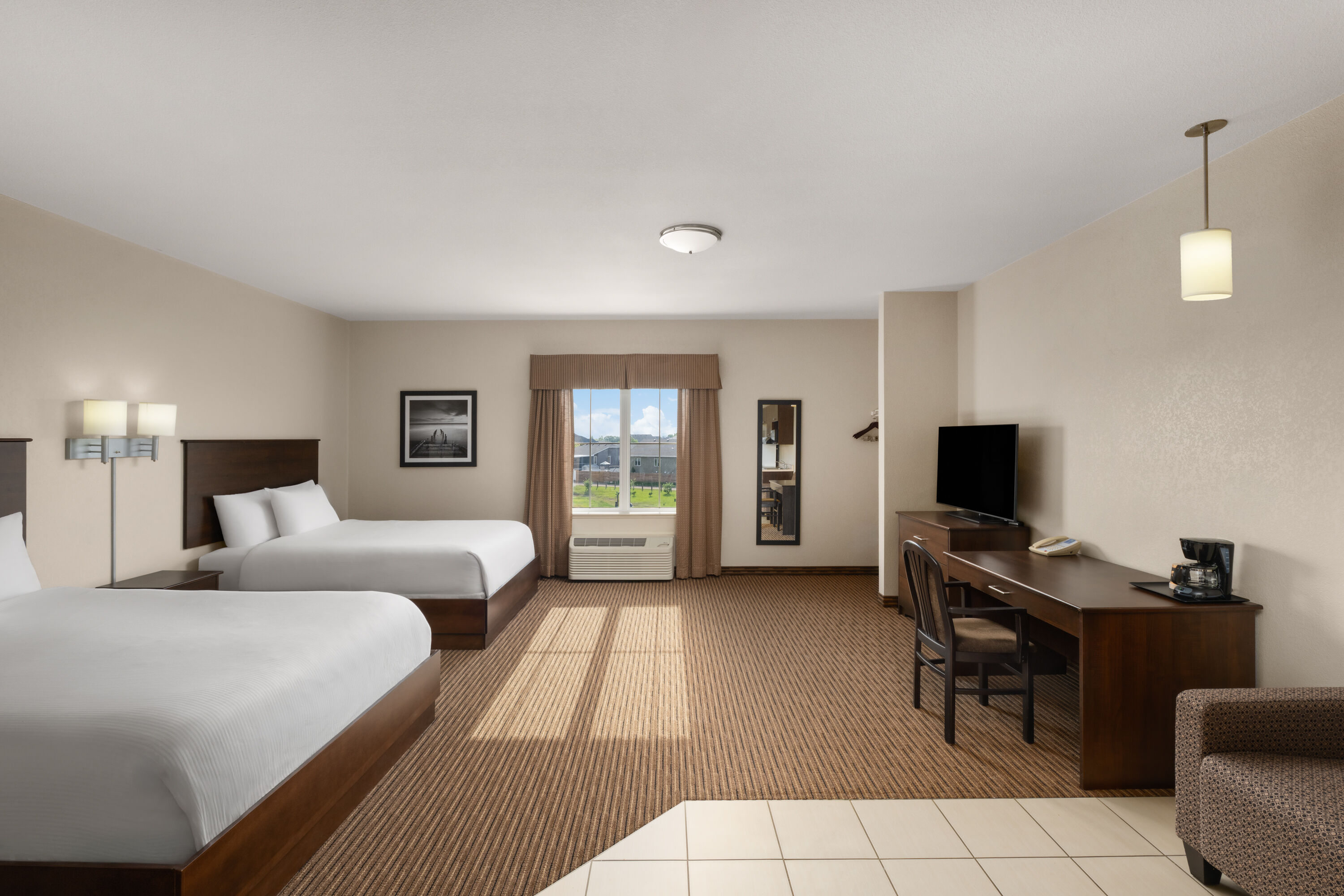 Guest room at the Travelodge Suites by Wyndham Estevan in Estevan, Saskatchewan