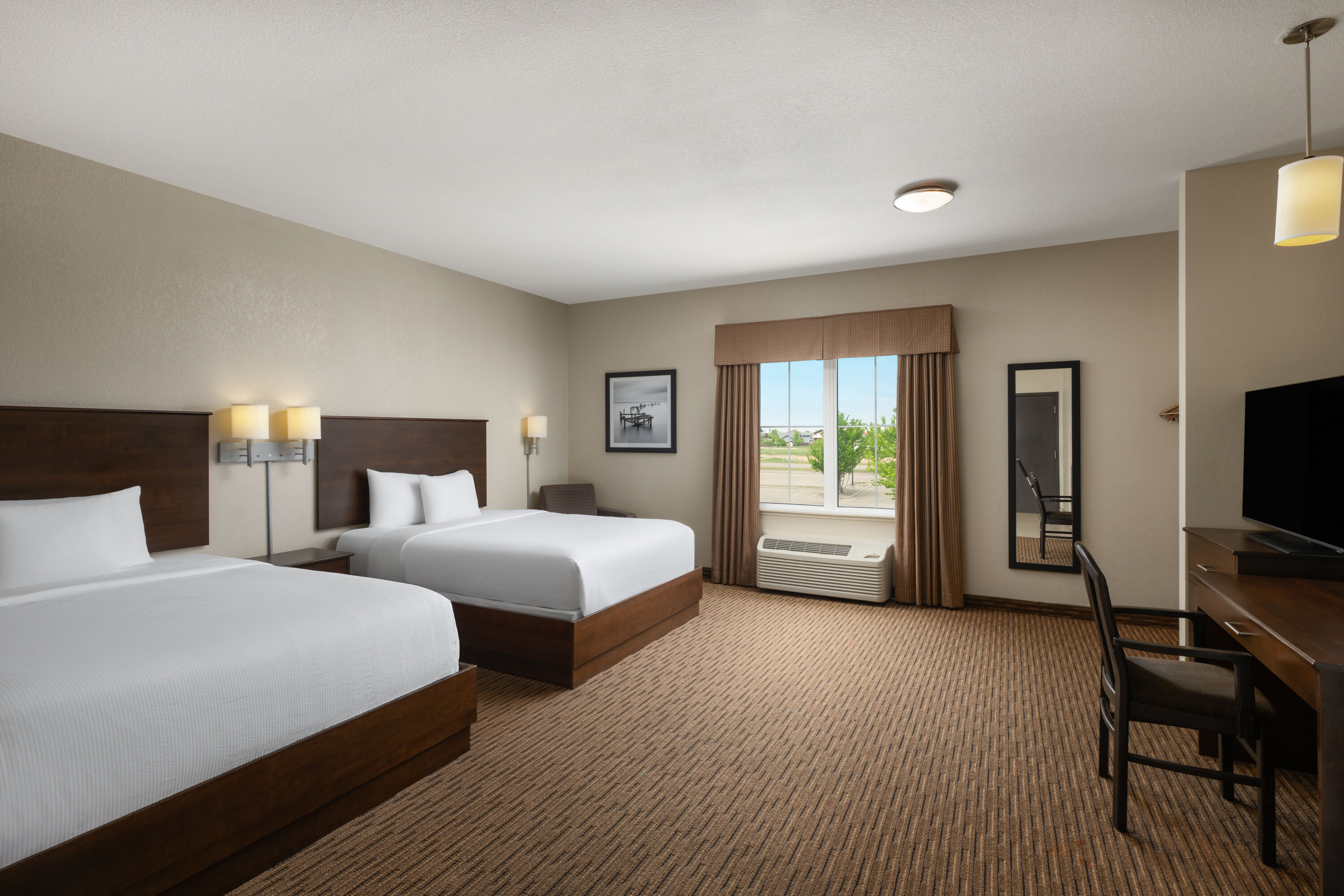Guest room at the Travelodge Suites by Wyndham Estevan in Estevan, Saskatchewan