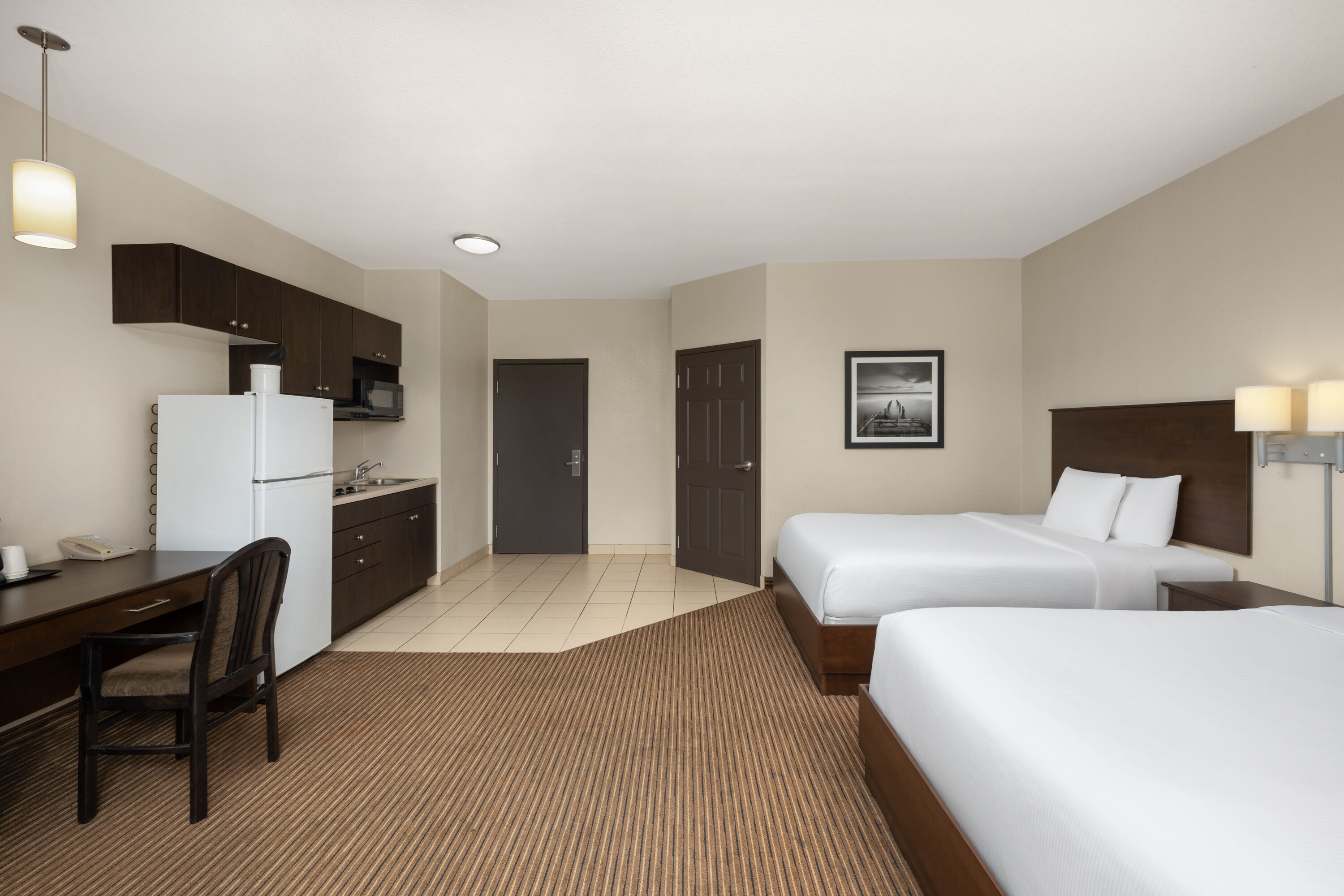 Guest room at the Travelodge Suites by Wyndham Estevan in Estevan, Saskatchewan